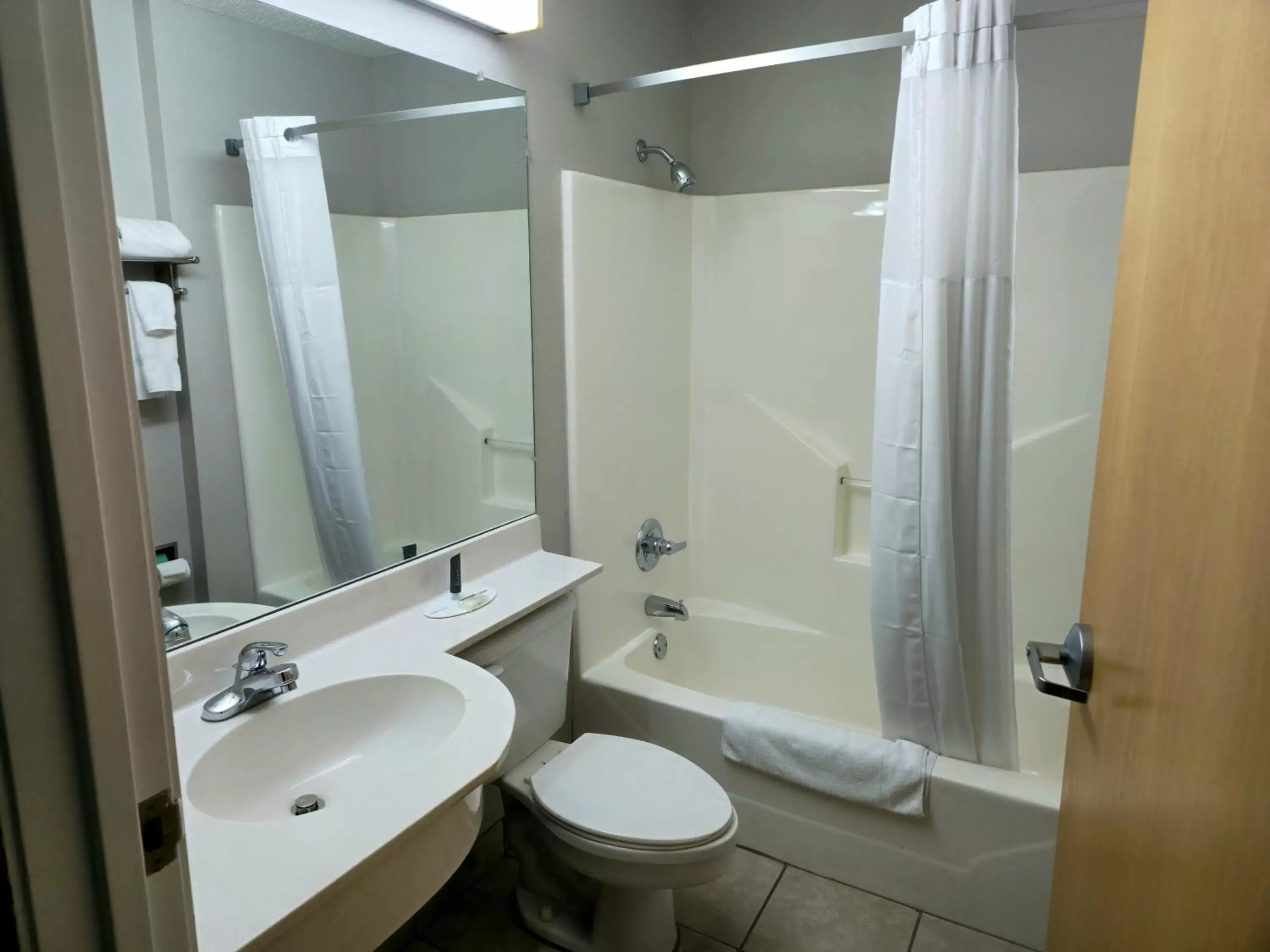 Property building, Bathroom in Microtel Inn & Suites Claremore