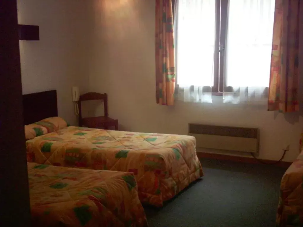 Photo of the whole room, Bed in Hôtel Sainte Agnès