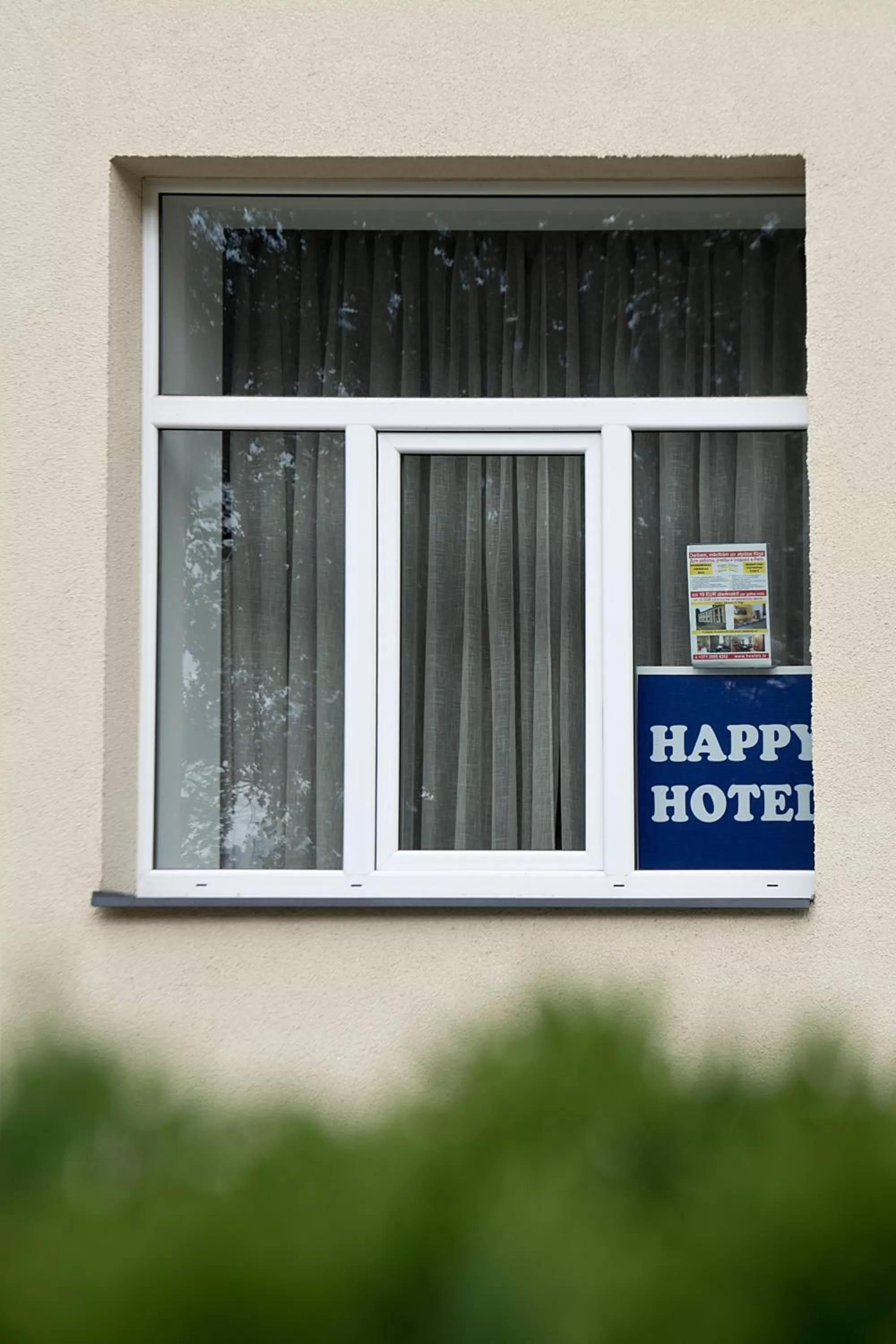 Property logo or sign in Happy Hotel