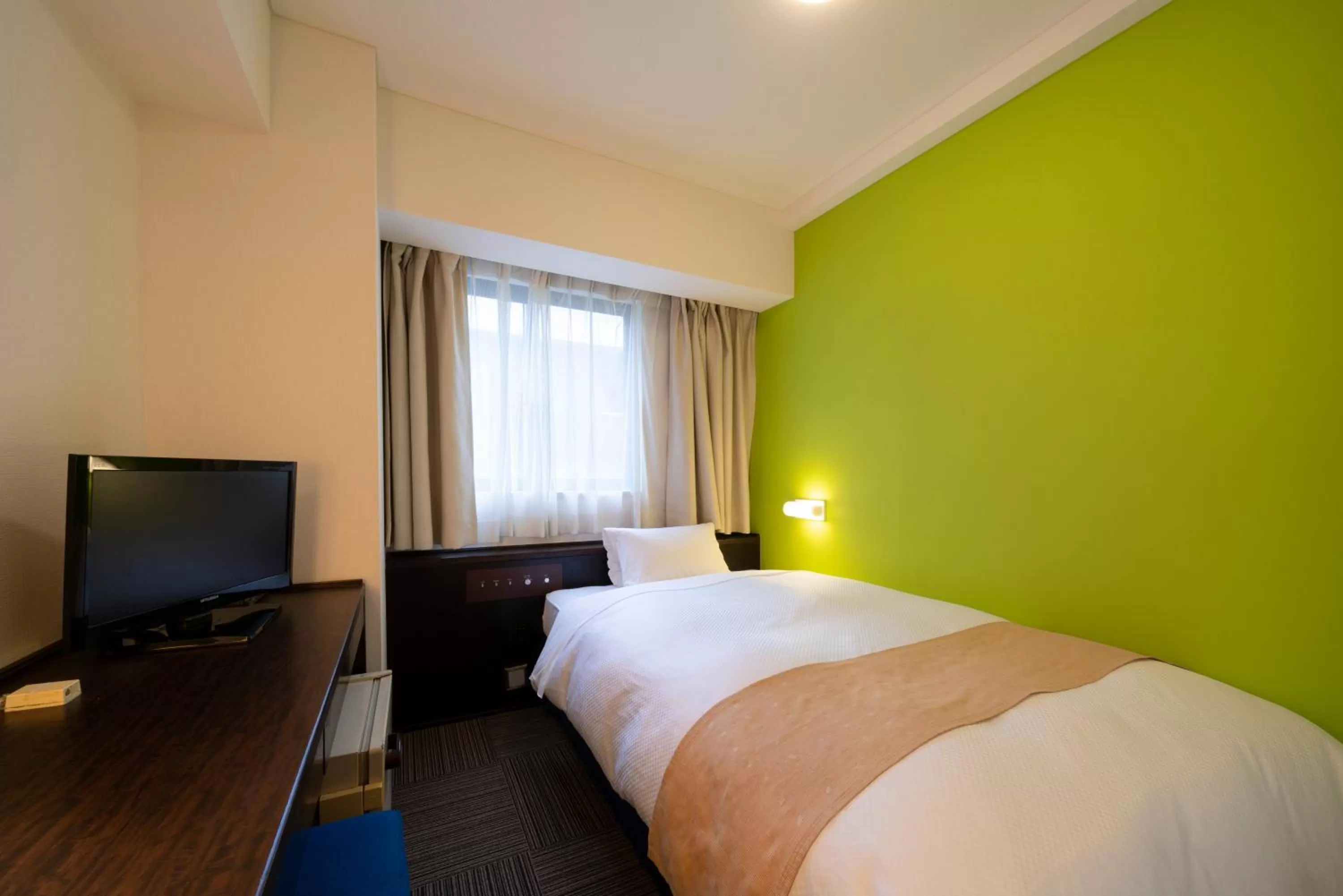 Communal lounge/ TV room, Bed in Hotel S-plus Nagoya Sakae