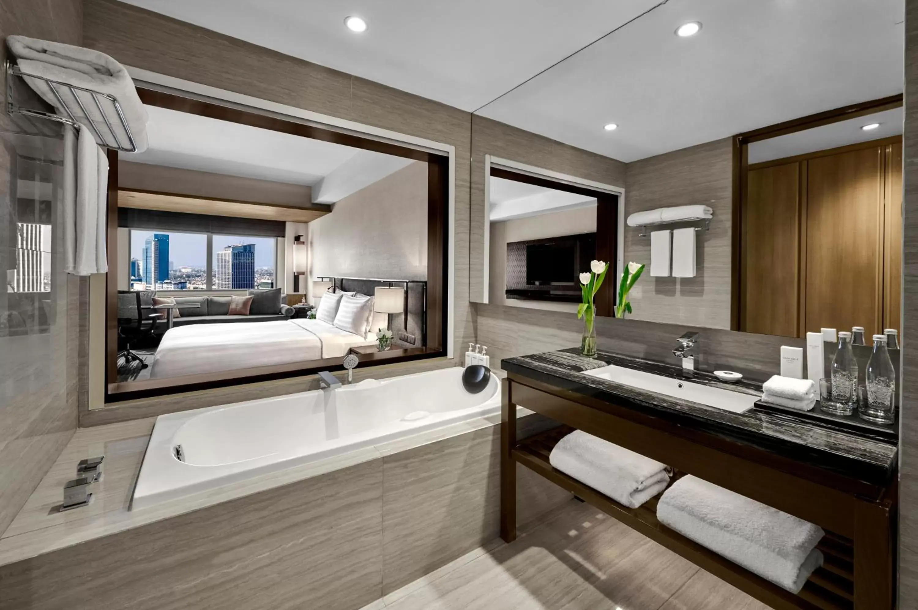 Bed, Bathroom in Gran Melia Jakarta