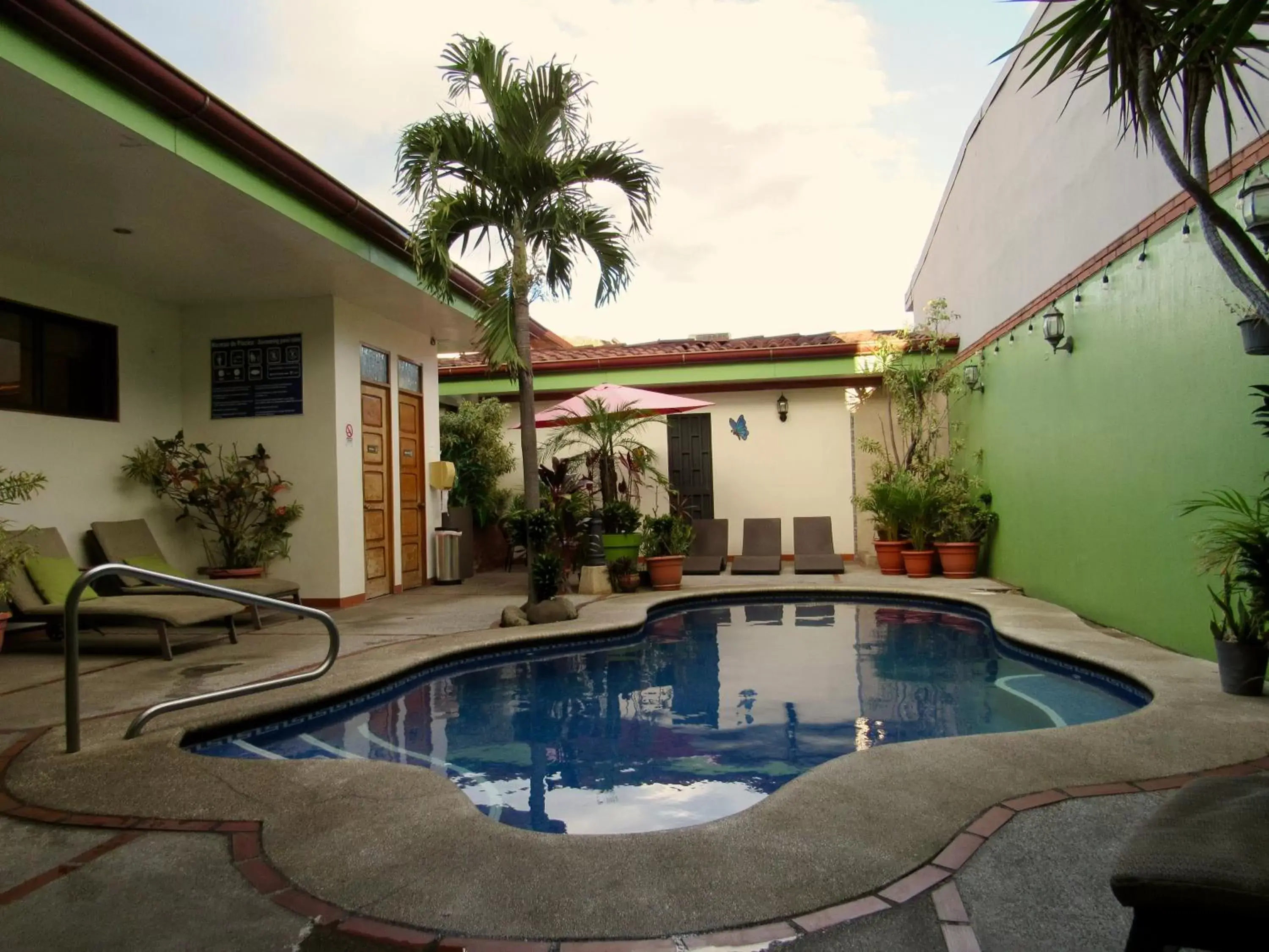 Property building, Swimming Pool in Hotel La Guaria Inn & Suites