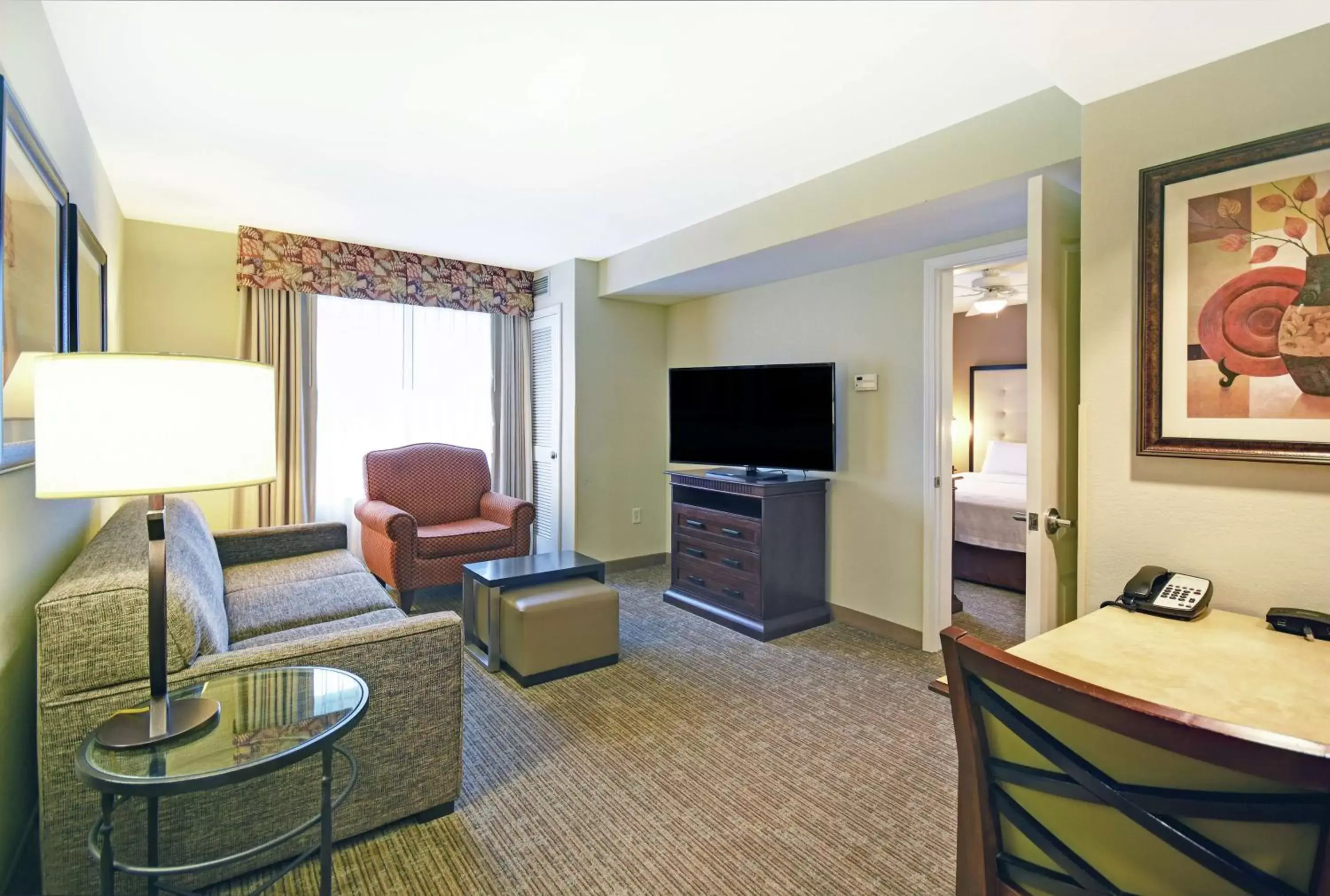 Bedroom, TV/Entertainment Center in Homewood Suites by Hilton Denver International Airport