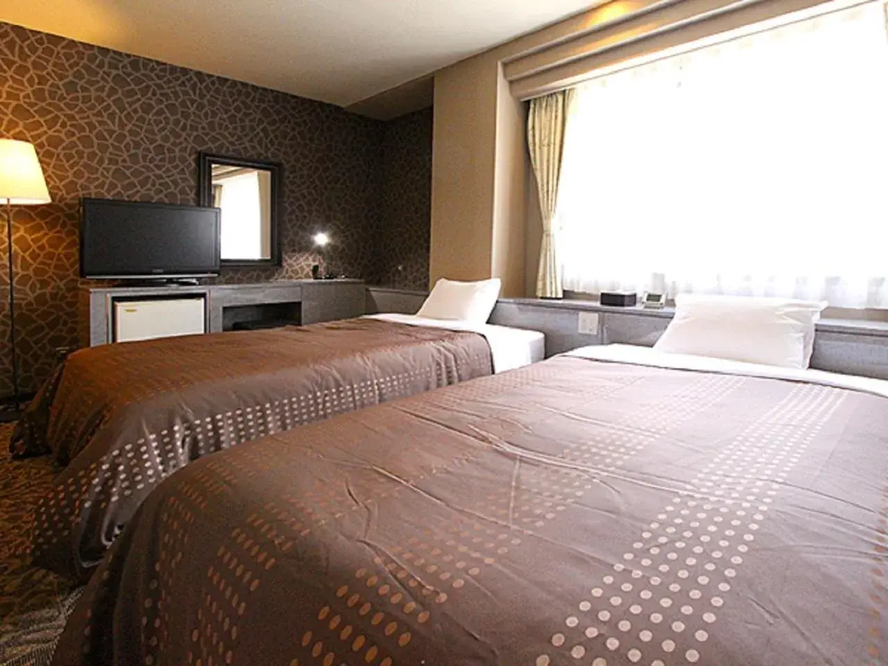 Bed in HOTEL LiVEMAX BUDGET Kobe
