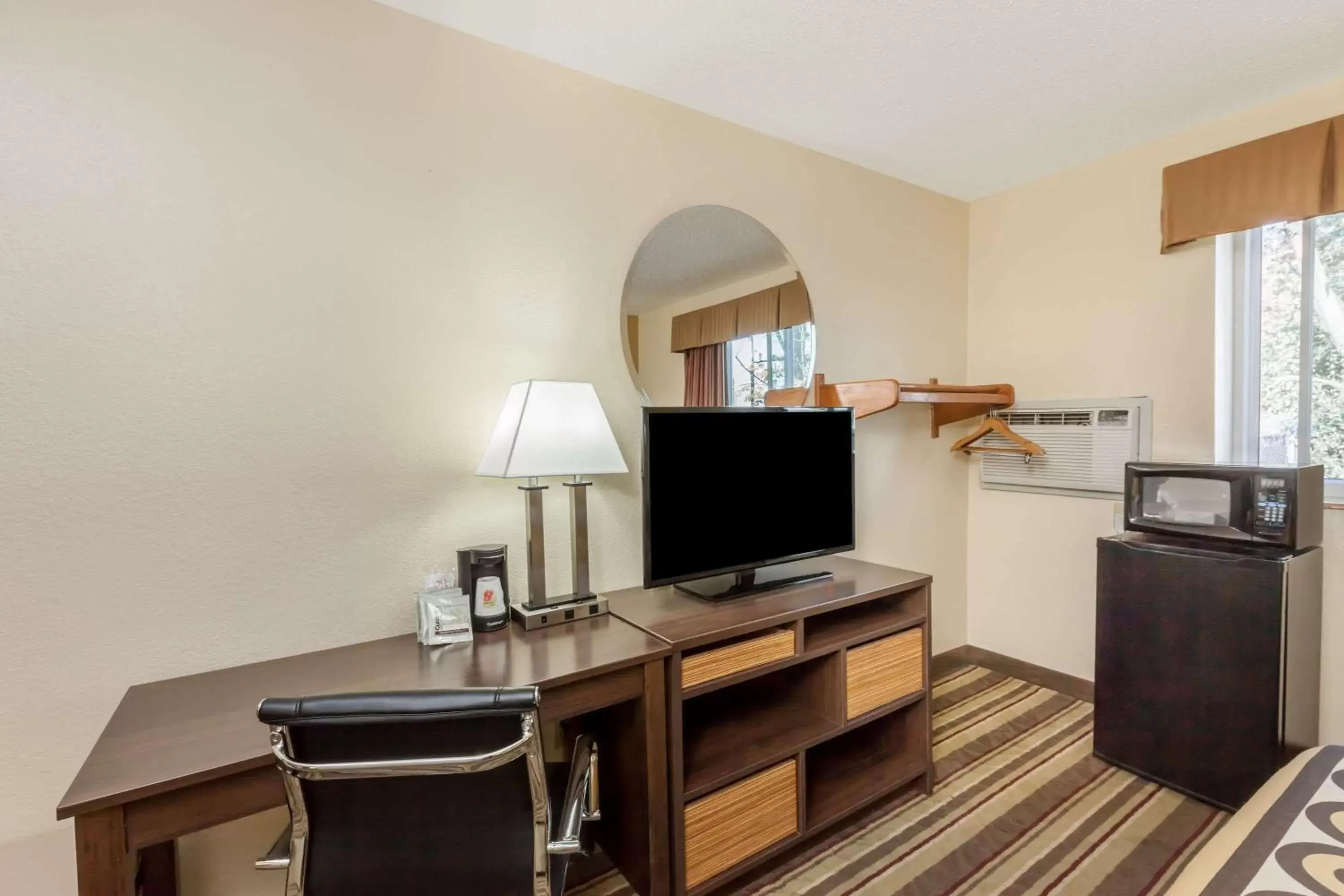 Photo of the whole room, TV/Entertainment Center in Super 8 by Wyndham Latham - Albany Airport