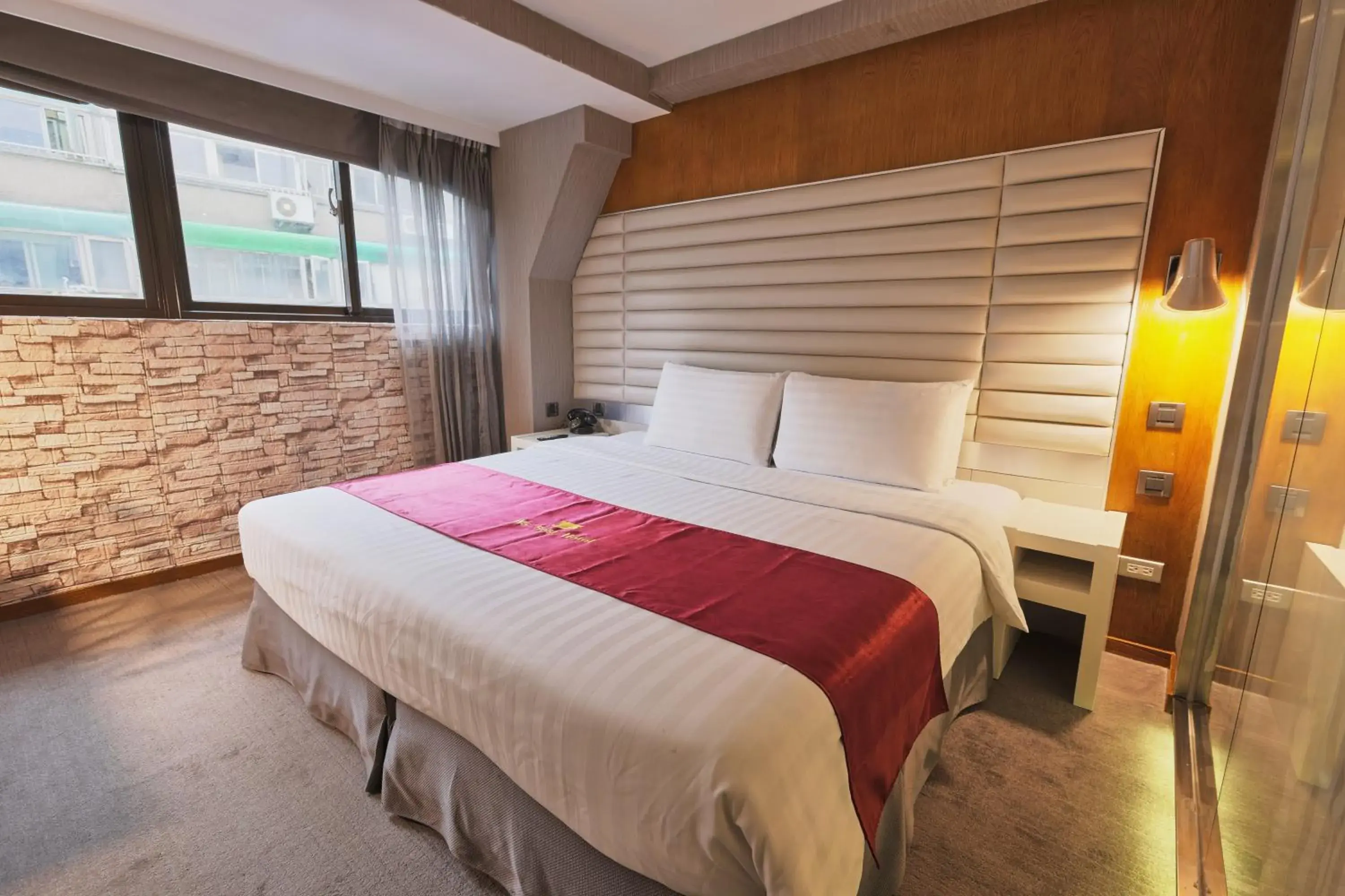 Bed in Li Duo Best Hotel
