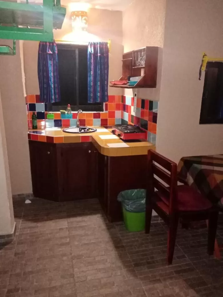 Kitchen or kitchenette in Cabañas Rústicas El Benny by Rotamundos