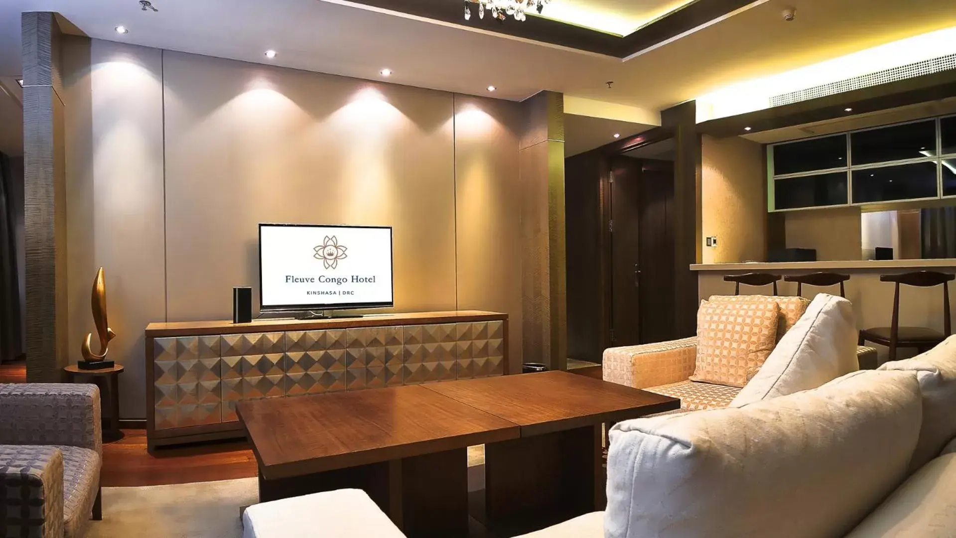 Communal lounge/ TV room in Fleuve Congo Hotel By Blazon Hotels