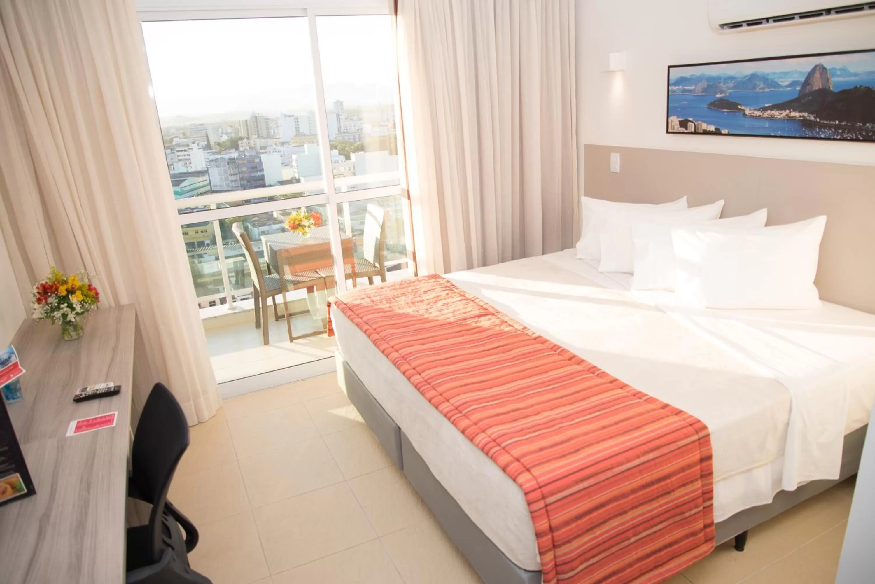 Bed in Ramada by Wyndham Macae Hotel & Suites