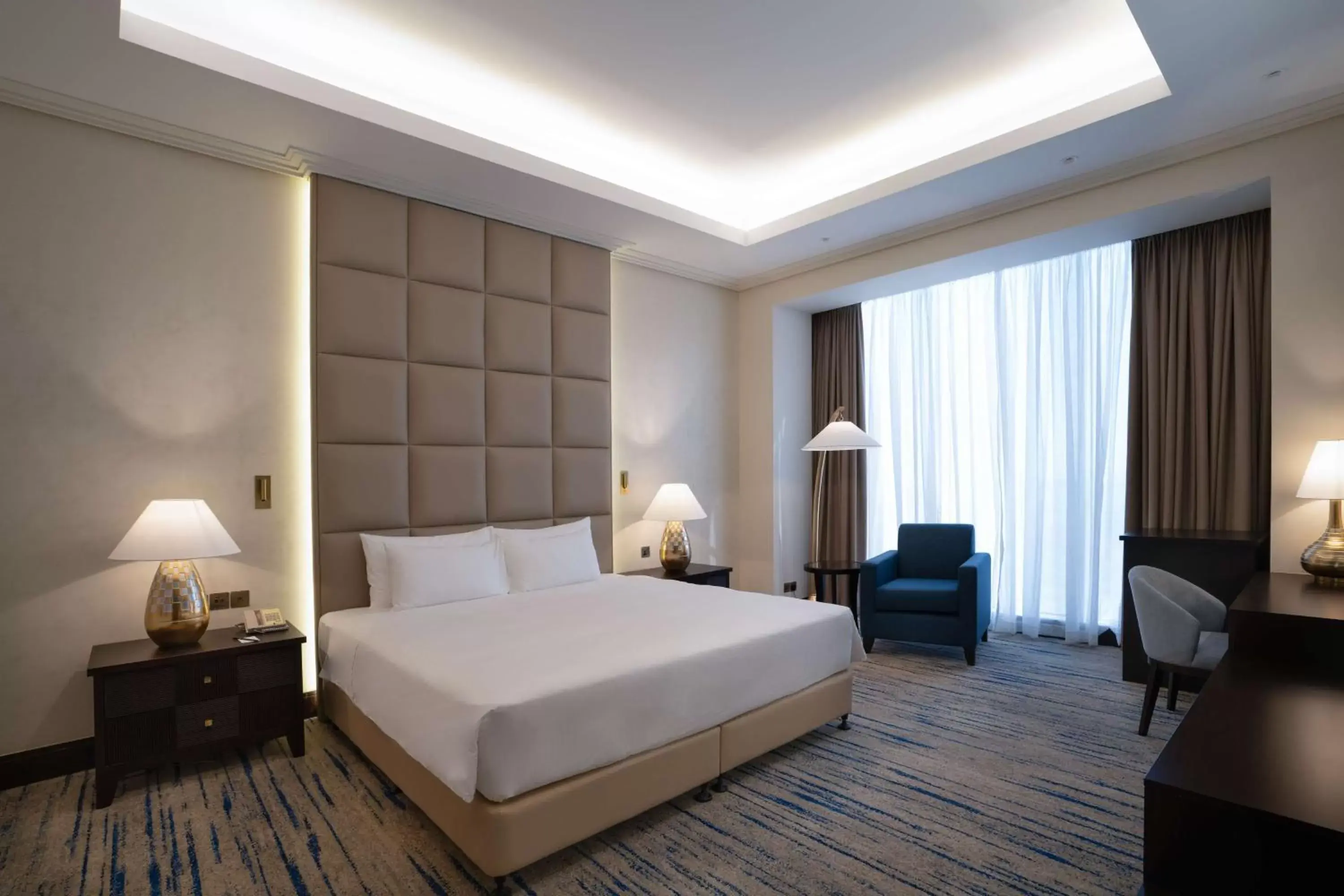 Photo of the whole room, Bed in The Diplomat Radisson Blu Hotel Residence & Spa
