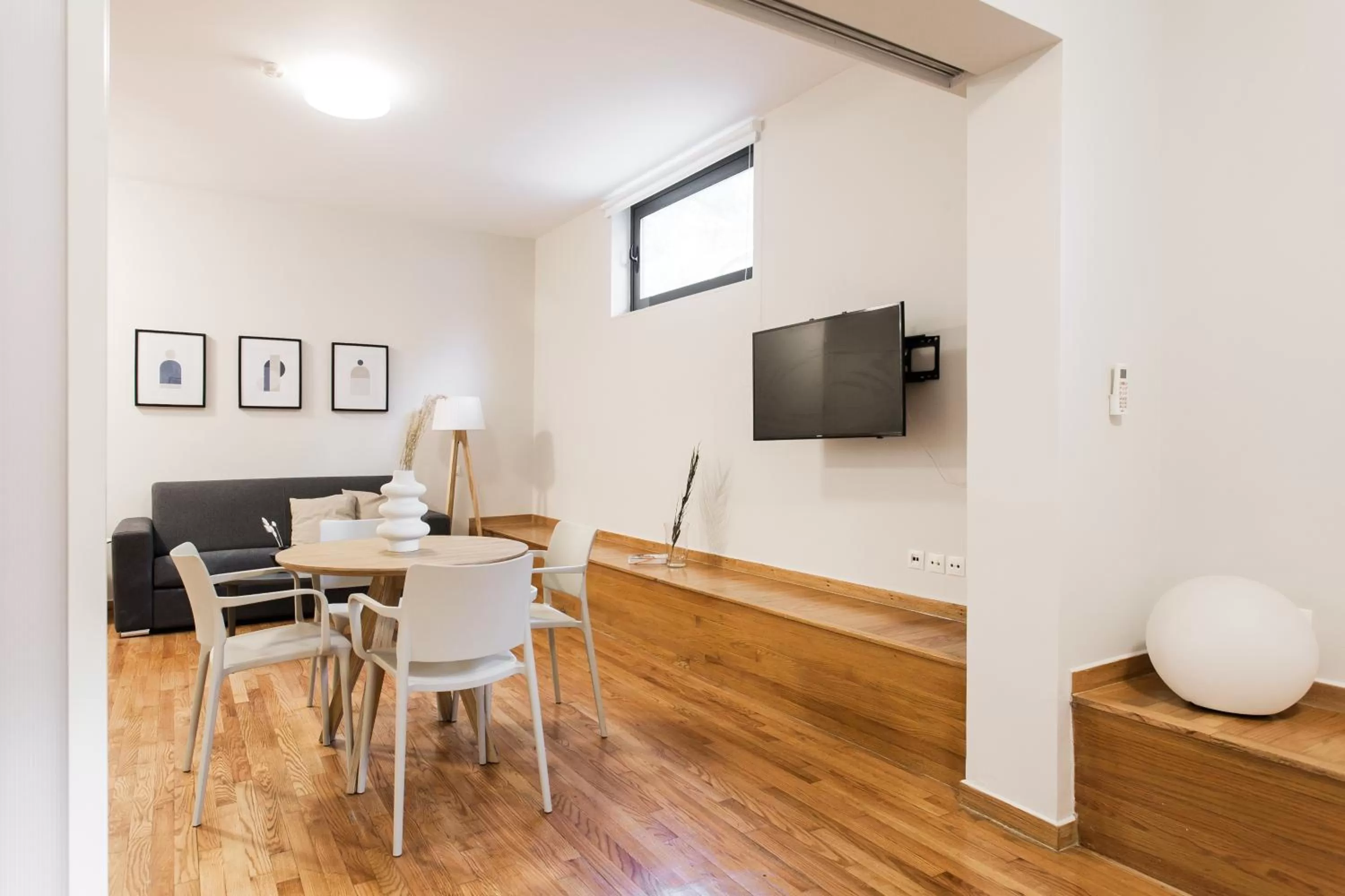 Living room, TV/Entertainment Center in ZOIA The Hill by UPSTREET