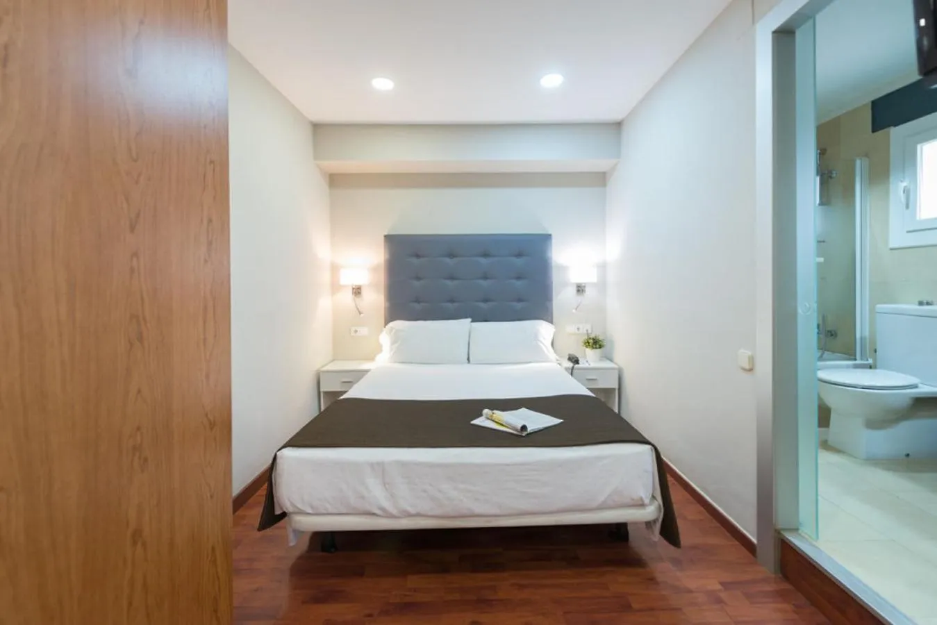 Bed in Senator Barcelona Apartments