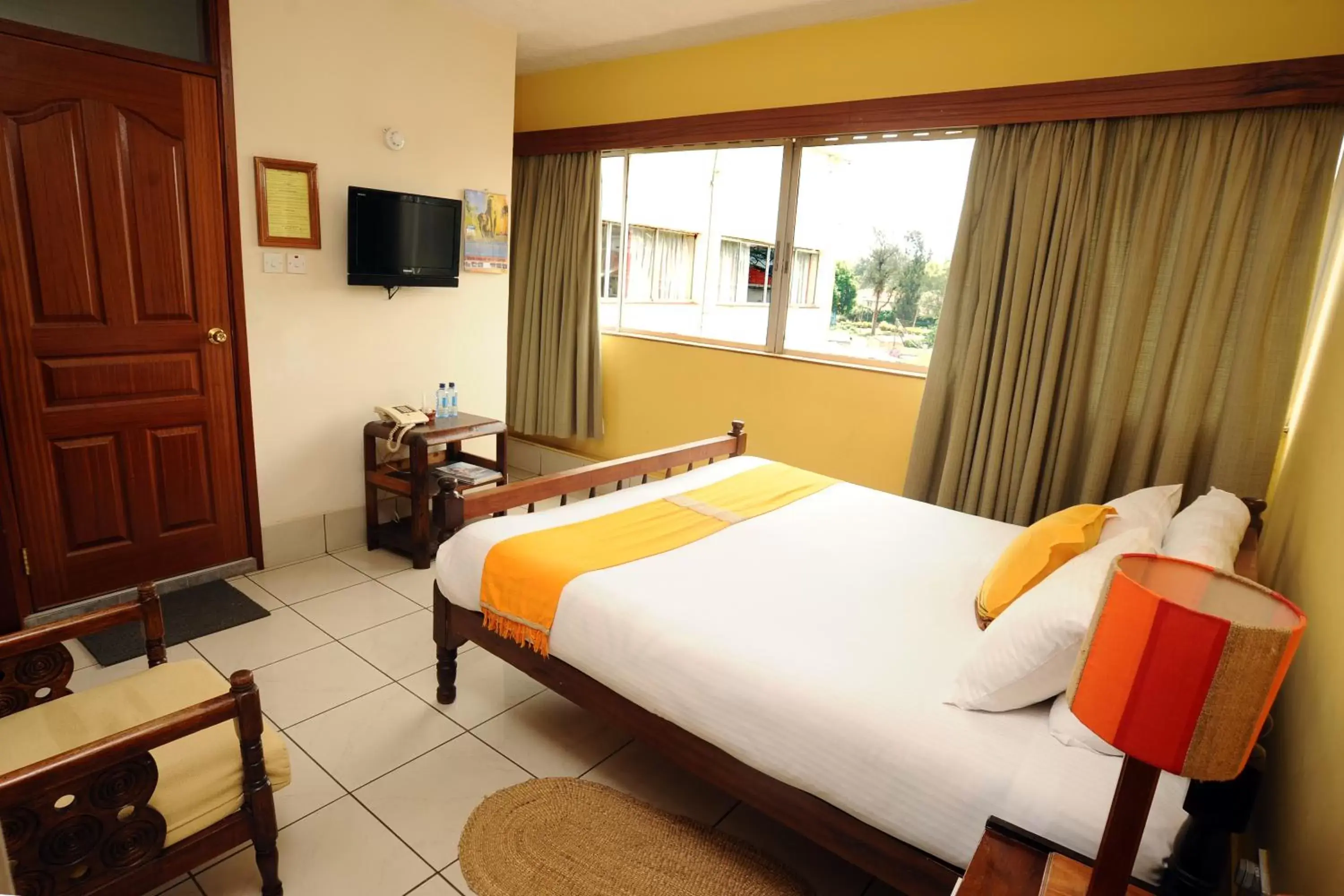Photo of the whole room, Bed in Kenya Comfort Suites