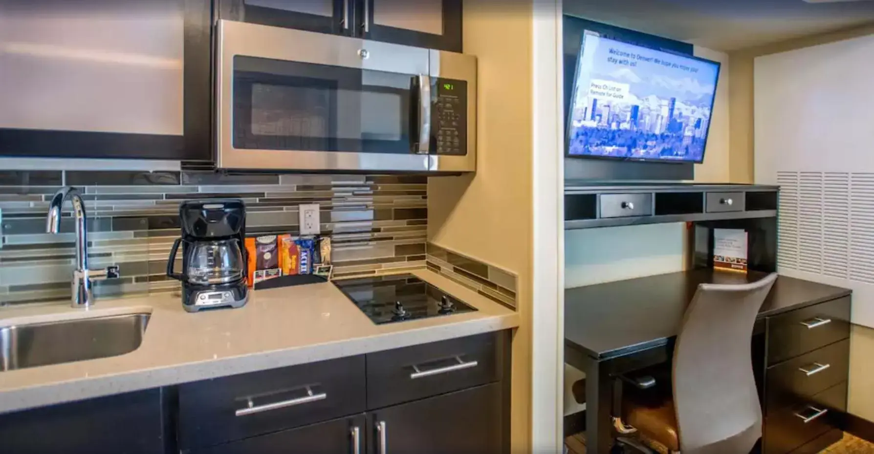 TV and multimedia, Kitchen/Kitchenette in Staybridge Suites Denver Downtown, an IHG Hotel