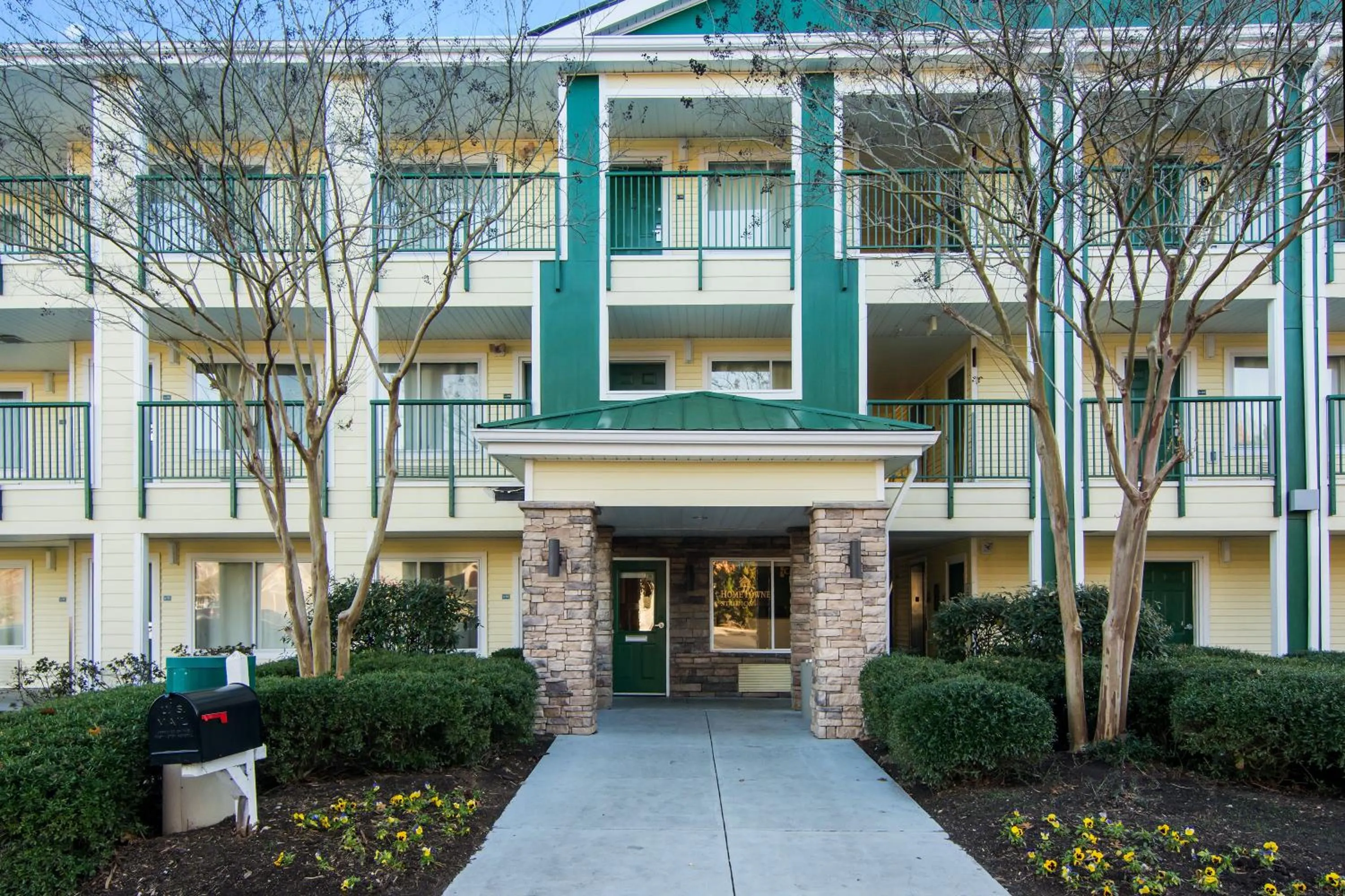 Property building in HomeTowne Studios by Red Roof Raleigh – Durham