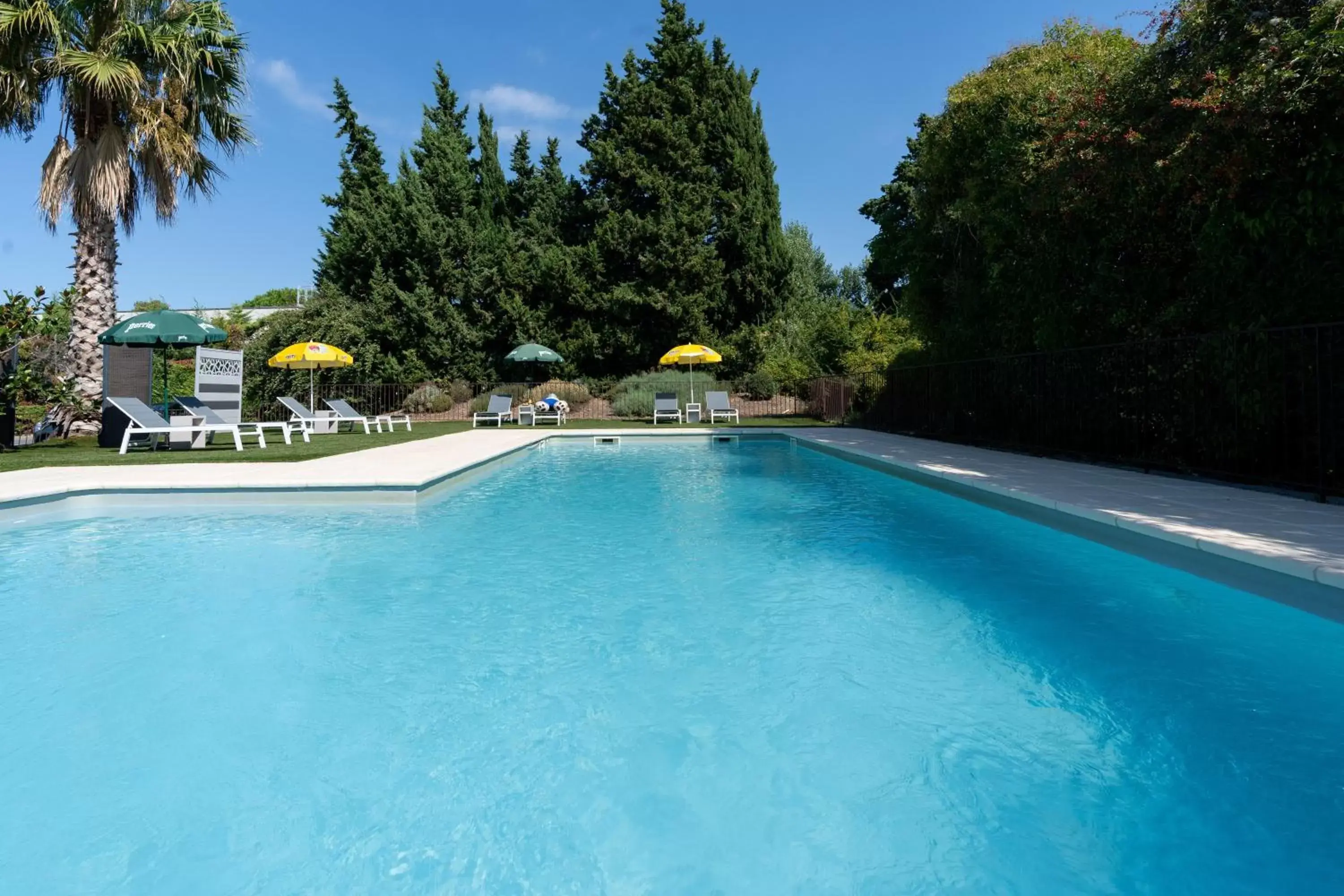 Swimming Pool in Brit Hotel Avignon Sud Le Calendal