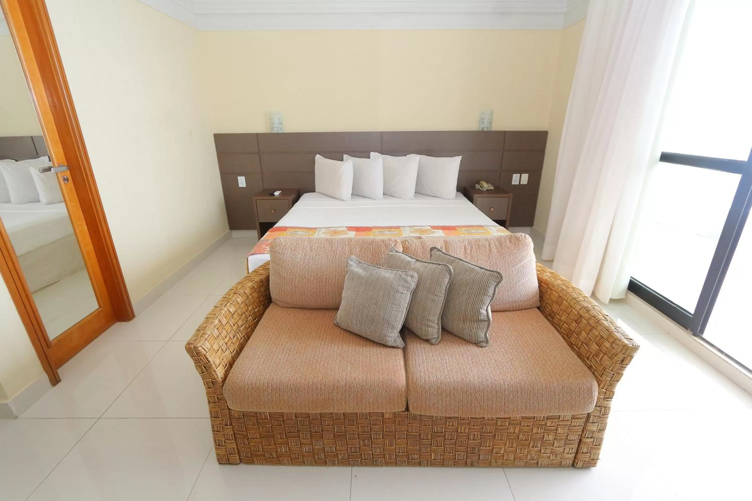 Bed in Tropical Executive Hotel