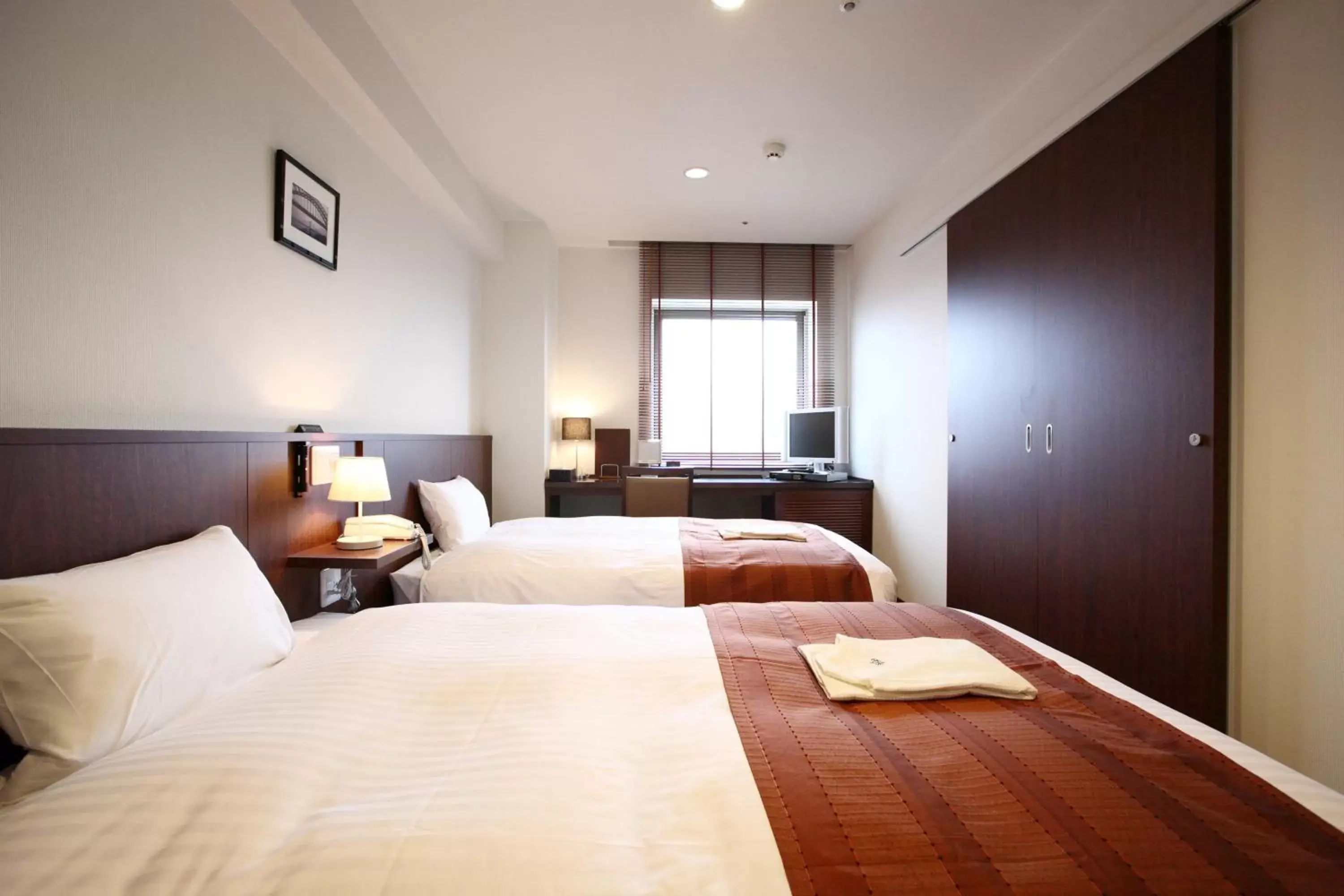 Bed in Sutton Hotel Hakata City