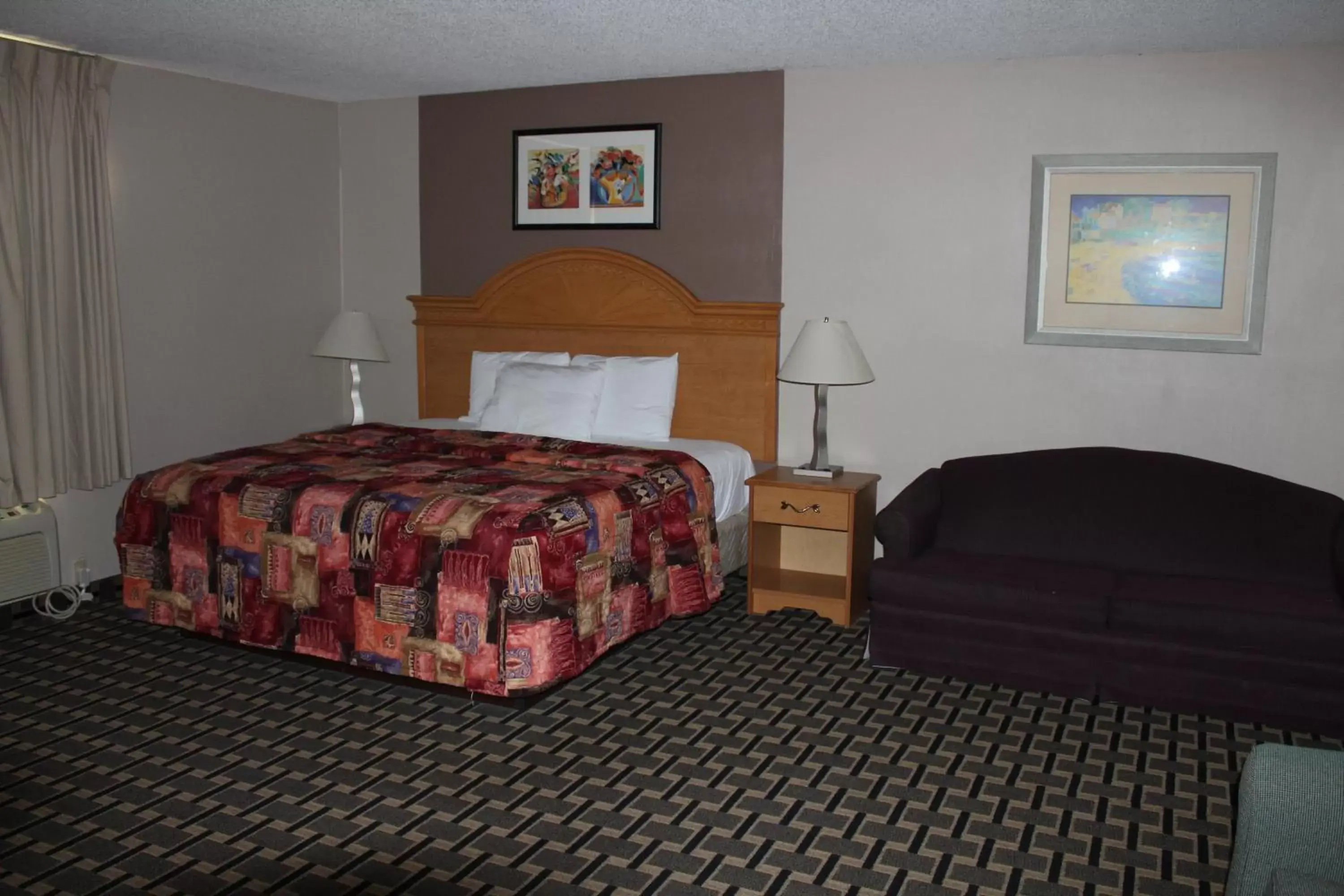 Bedroom, Bed in Coratel Inn and Suites Maple Grove
