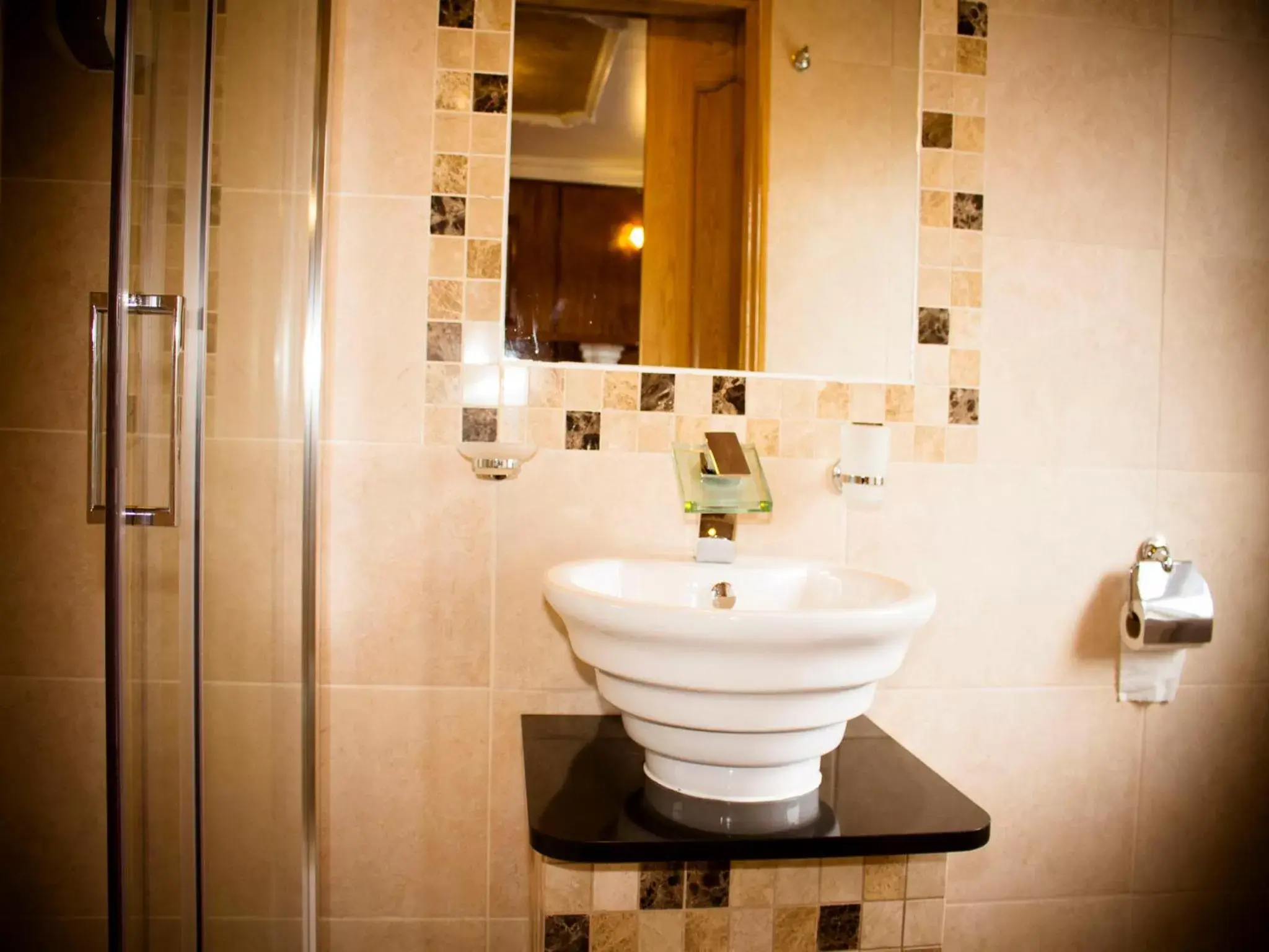 Decorative detail, Bathroom in Cricklewood Lodge Hotel
