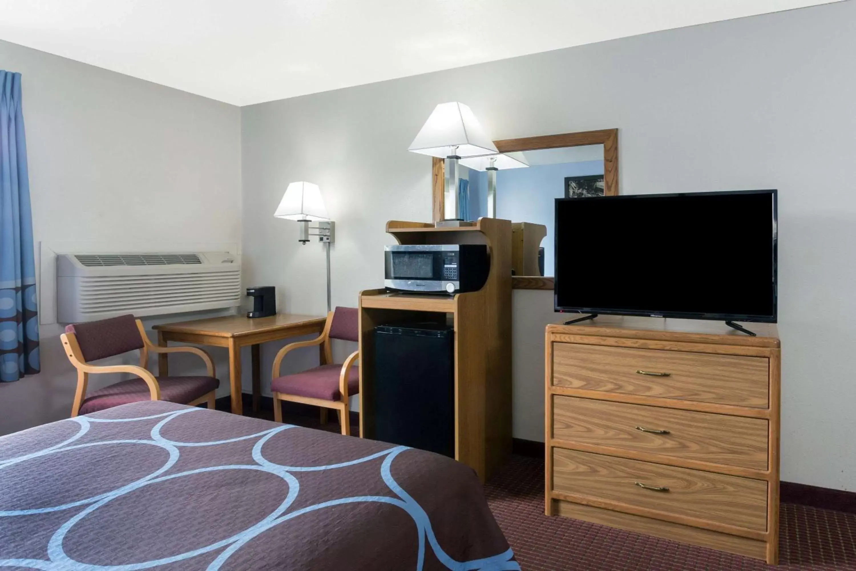 Photo of the whole room, TV/Entertainment Center in Super 8 by Wyndham Wisconsin Dells