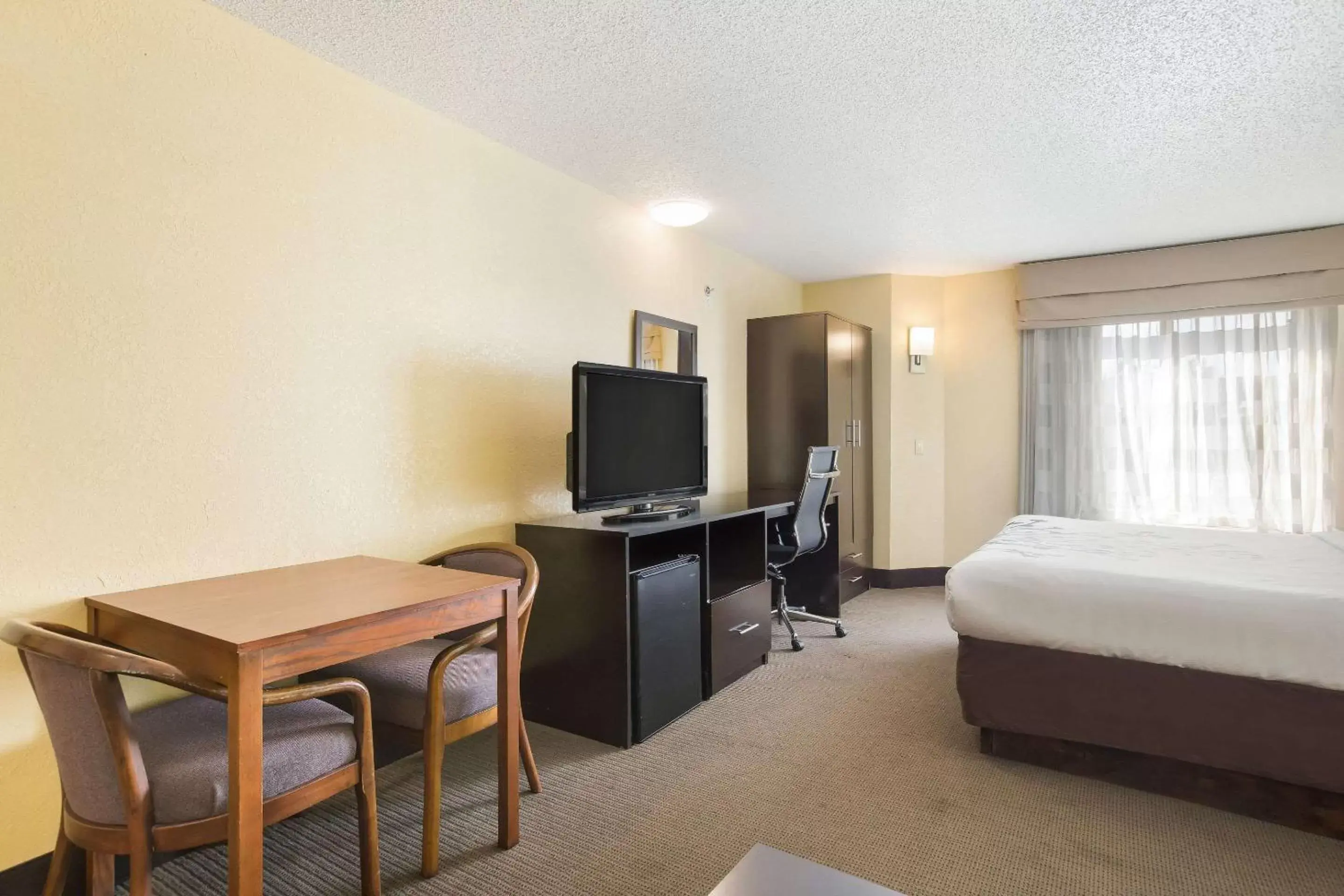 Photo of the whole room, TV/Entertainment Center in Sleep Inn & Suites