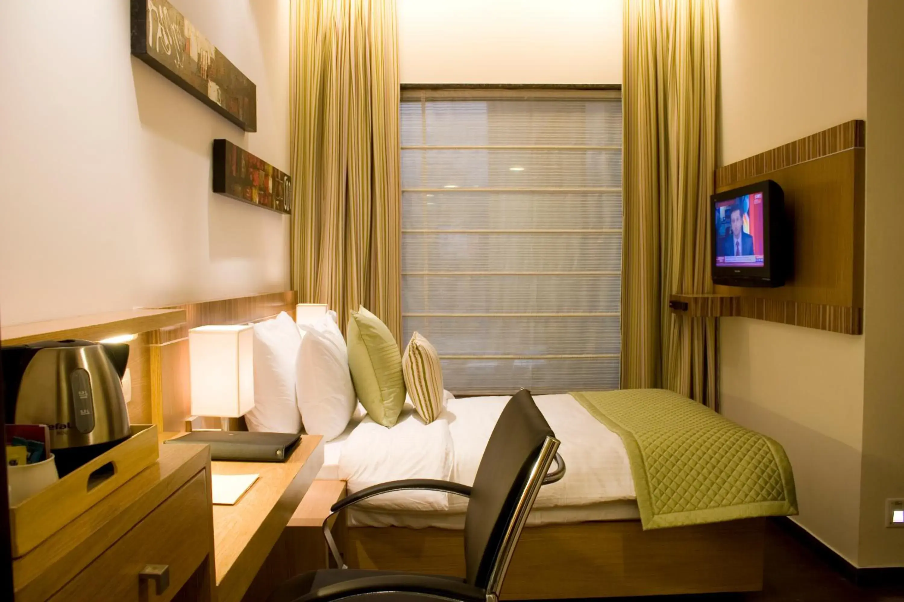 Bedroom, TV/Entertainment Center in Shervani Hotel Nehru Place