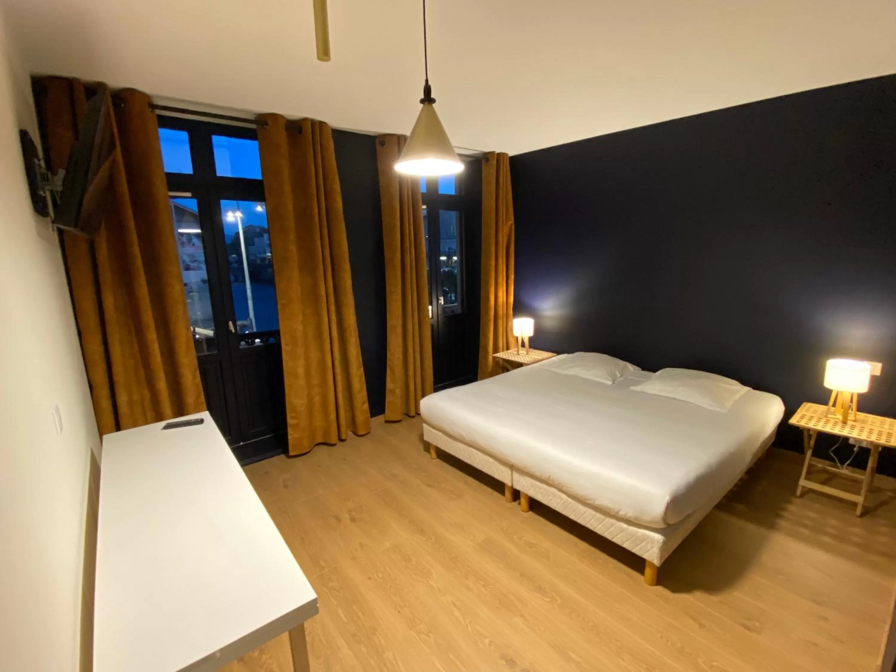 Bedroom in Le Miredames Hôtel-Bar