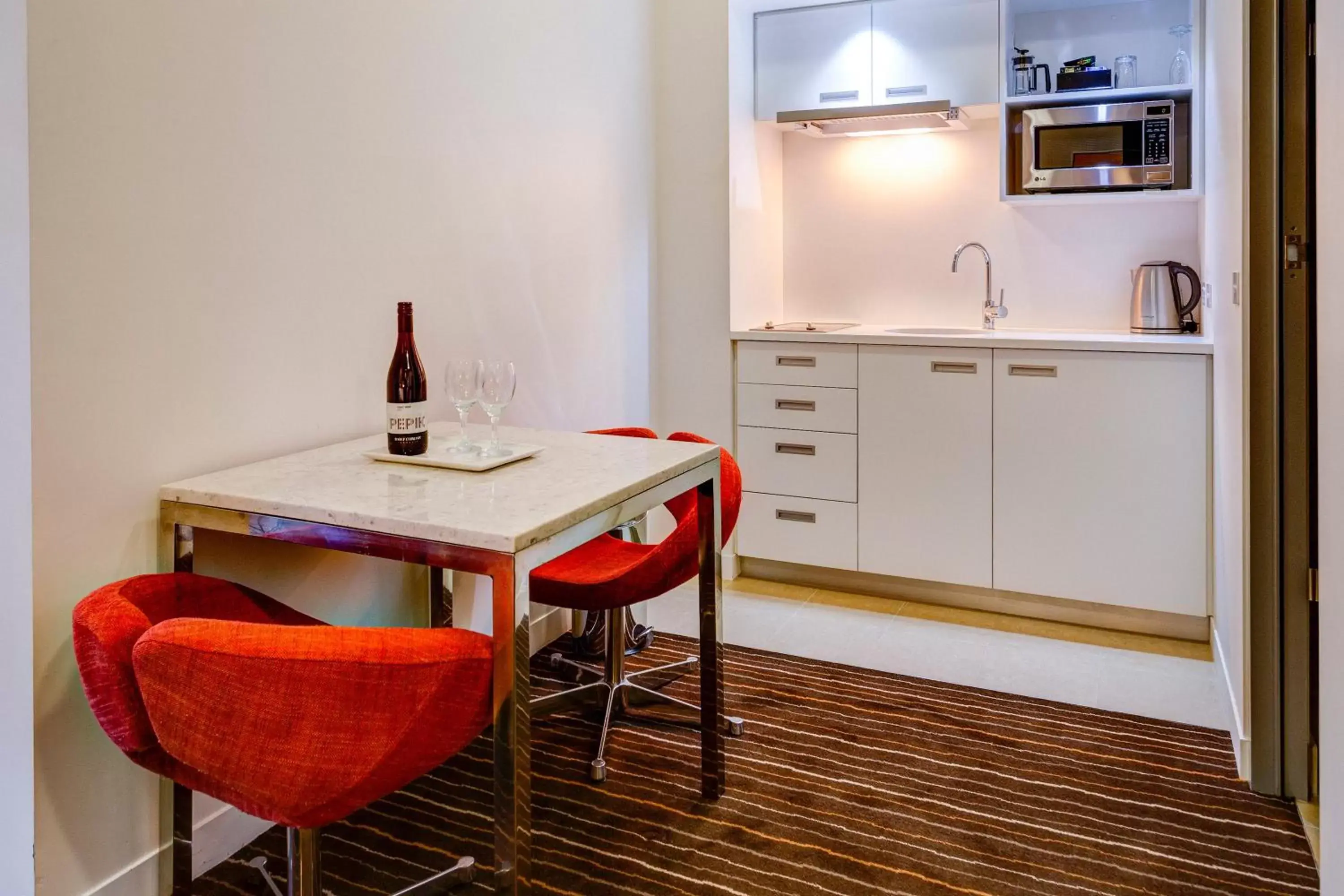 Kitchen or kitchenette, Dining Area in Mantra Charles Hotel