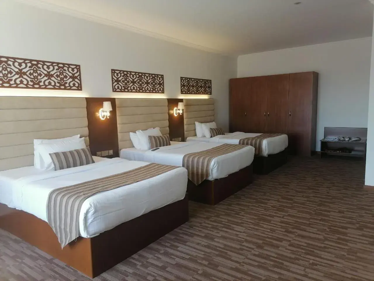 Bed in Hamdan Plaza Hotel Salalah, an HTG Hotel