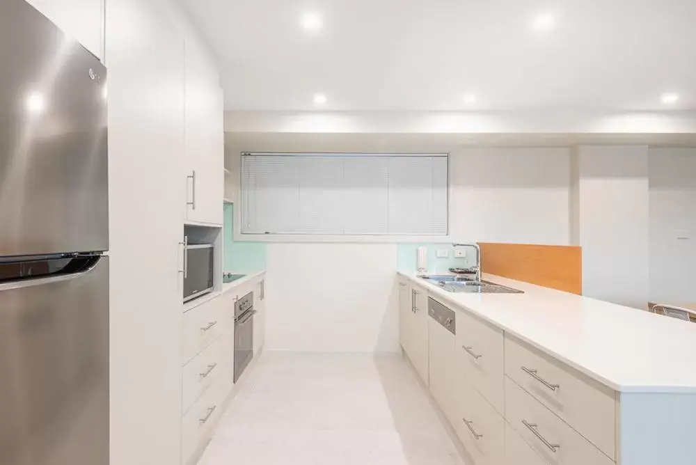 Kitchen/Kitchenette in Warners Bay Apartments