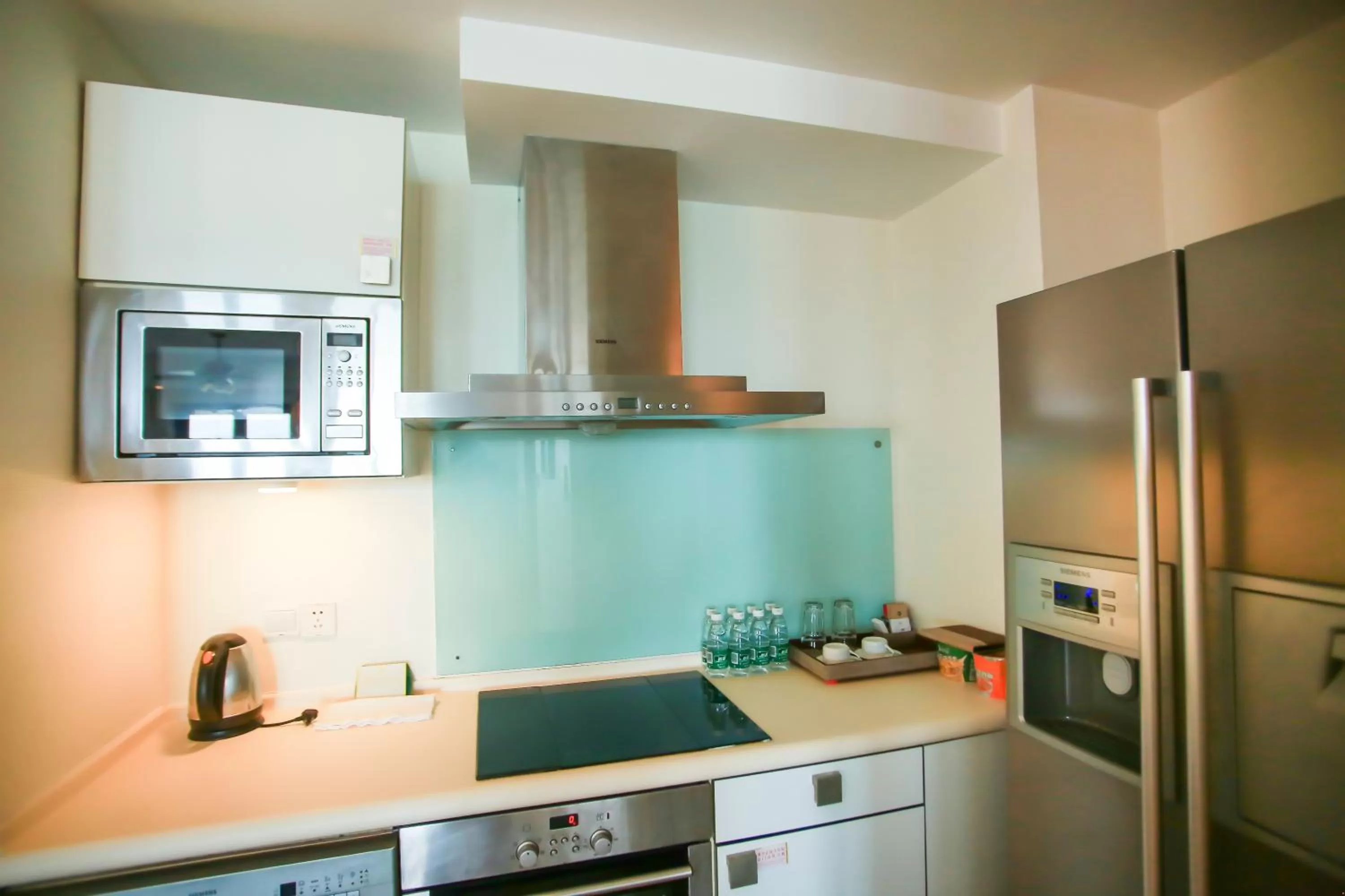 Kitchen or kitchenette in Aegean Suites Sanya Yalong Bay Resort