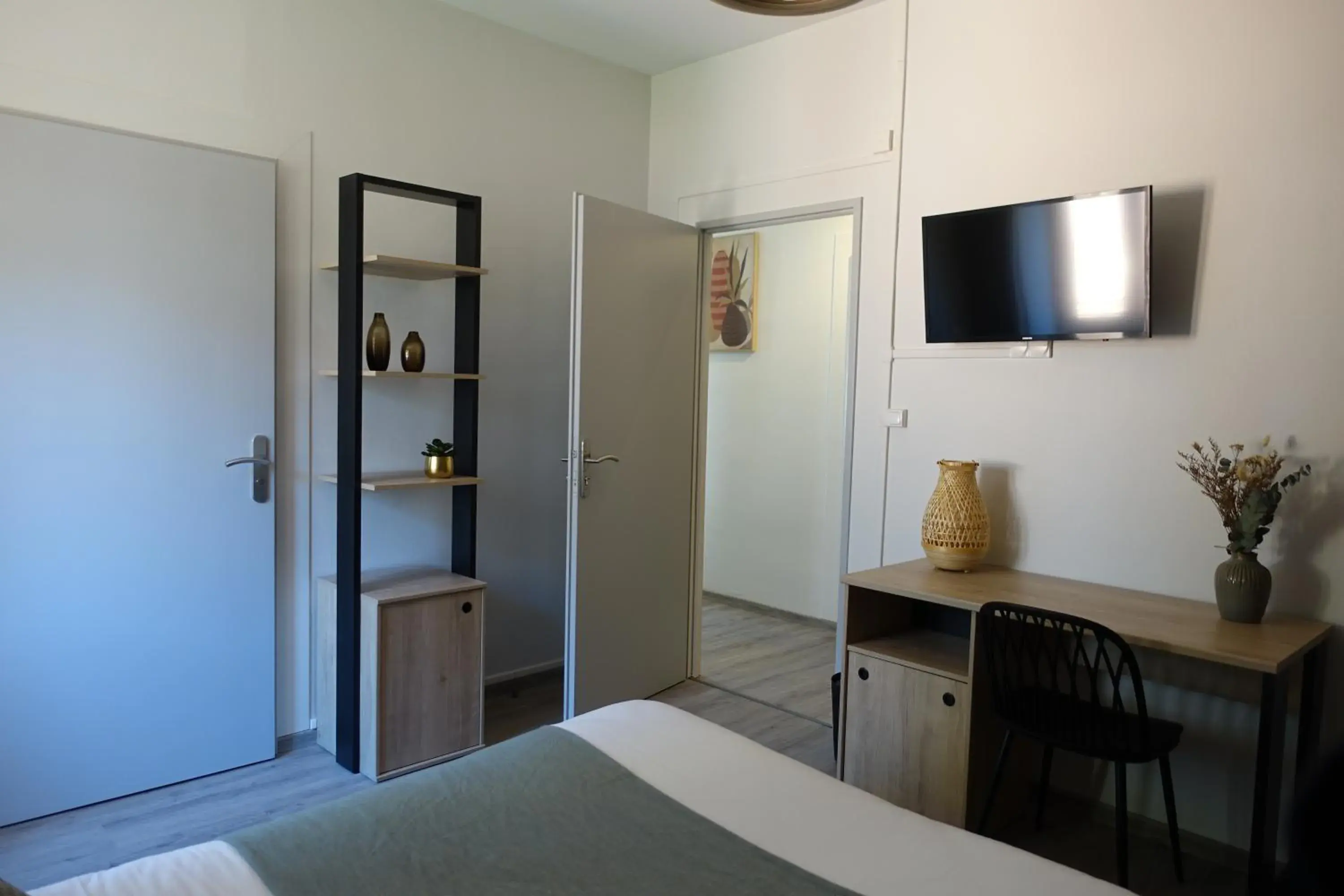 Bathroom, TV/Entertainment Center in Logis Hôtel Emeraude