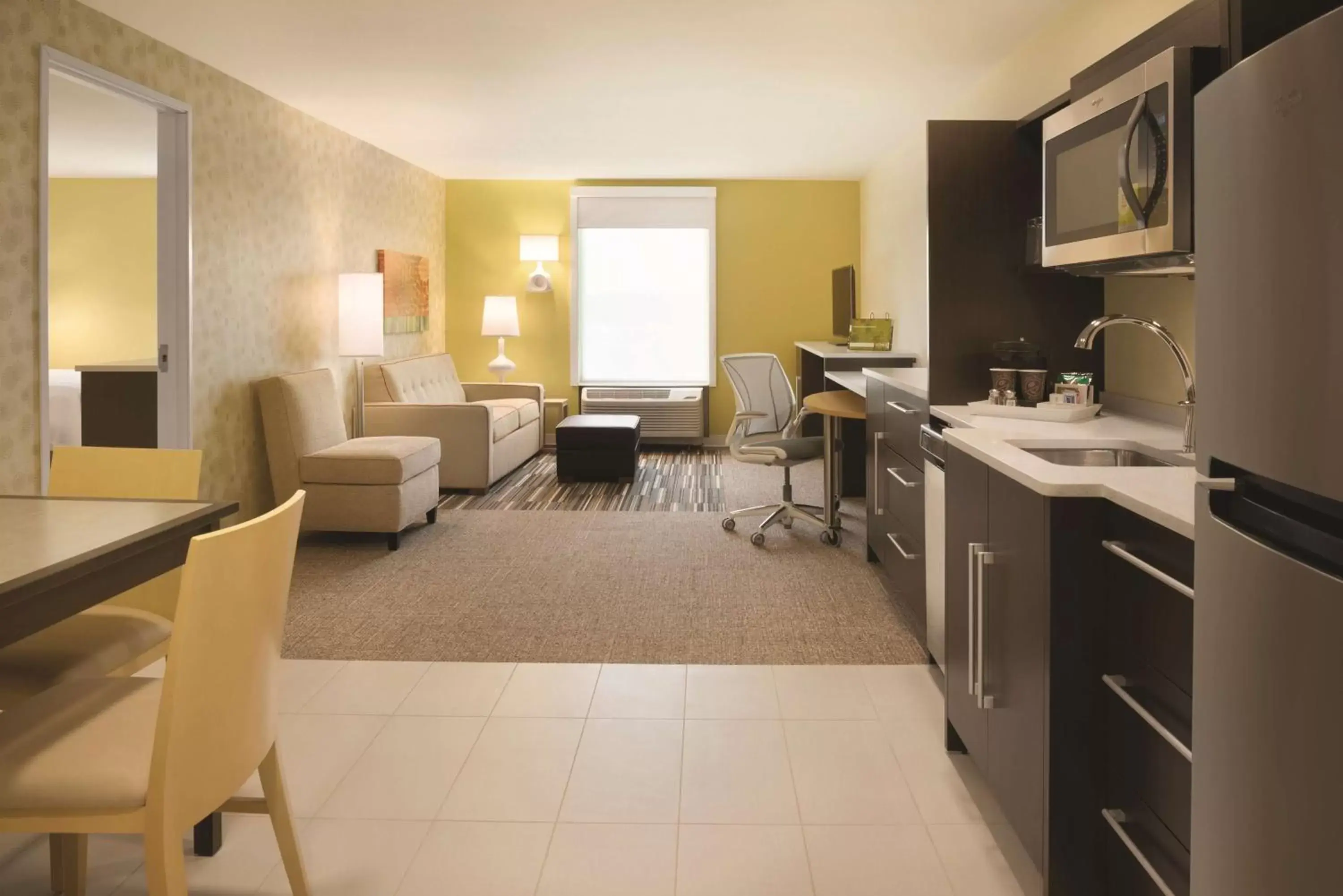 Bedroom, Kitchen/Kitchenette in Home2 Suites By Hilton Iowa City Coralville