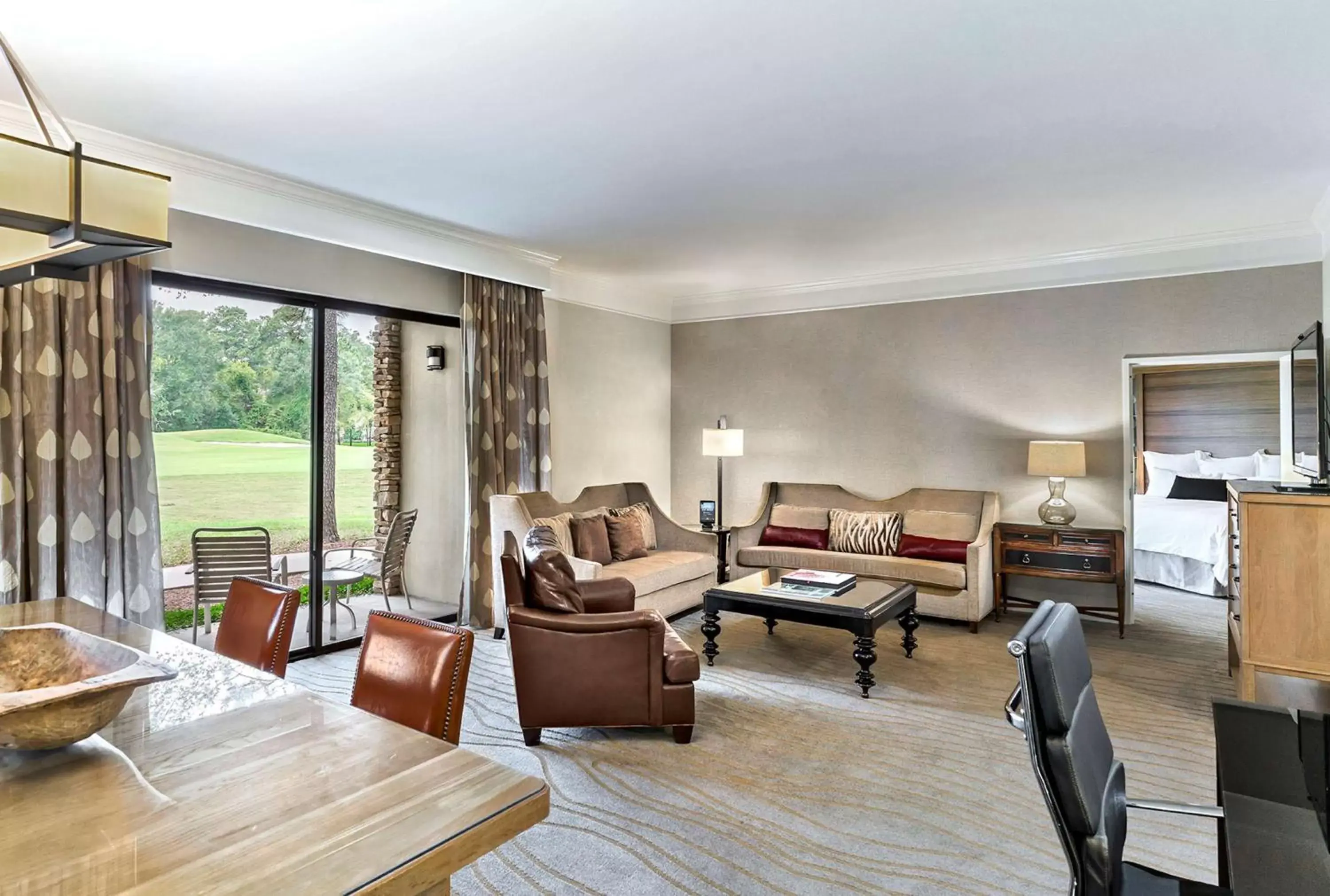 Living room, Seating Area in The Woodlands Resort, Curio Collection by Hilton