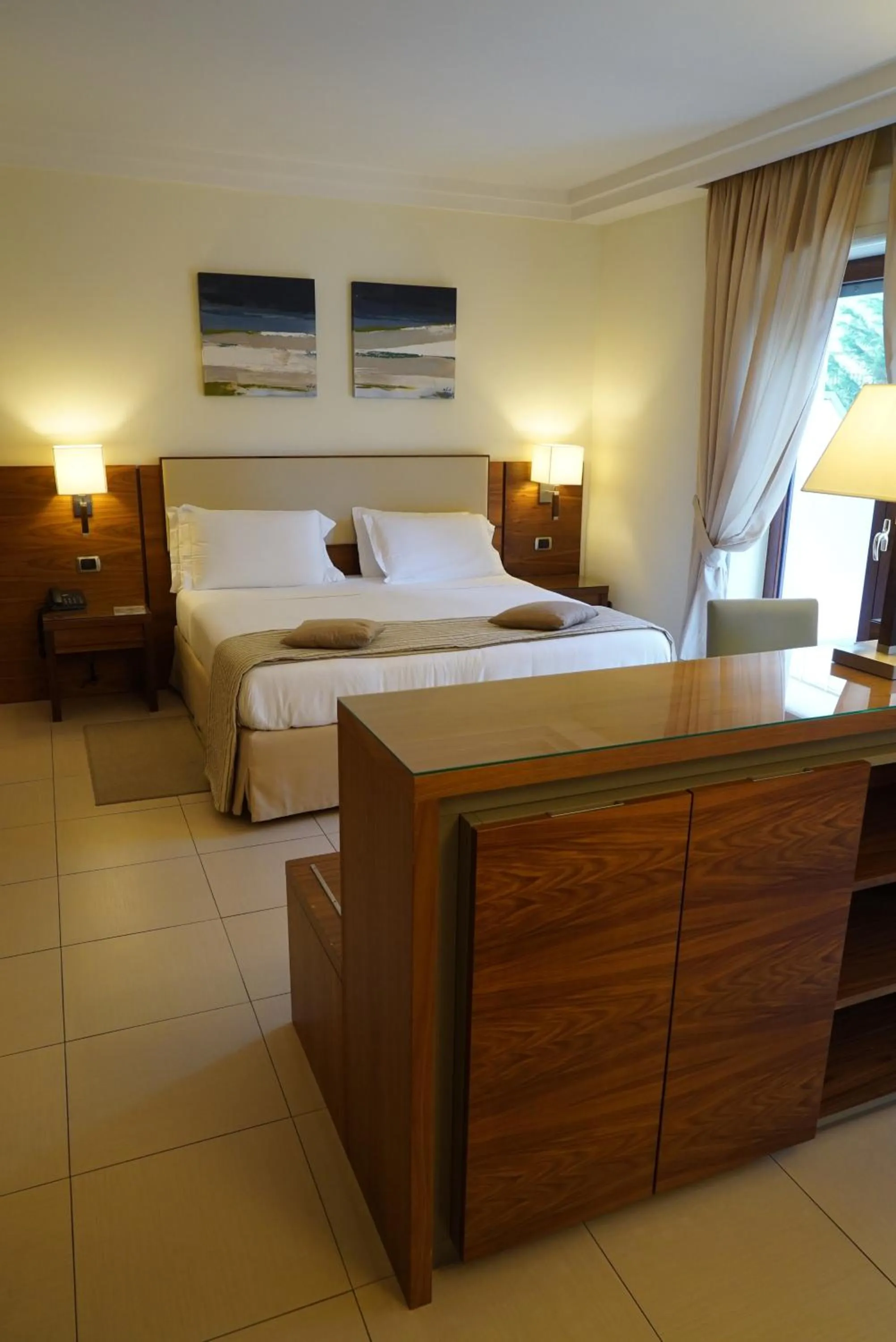 Bed in Suites & Residence Hotel
