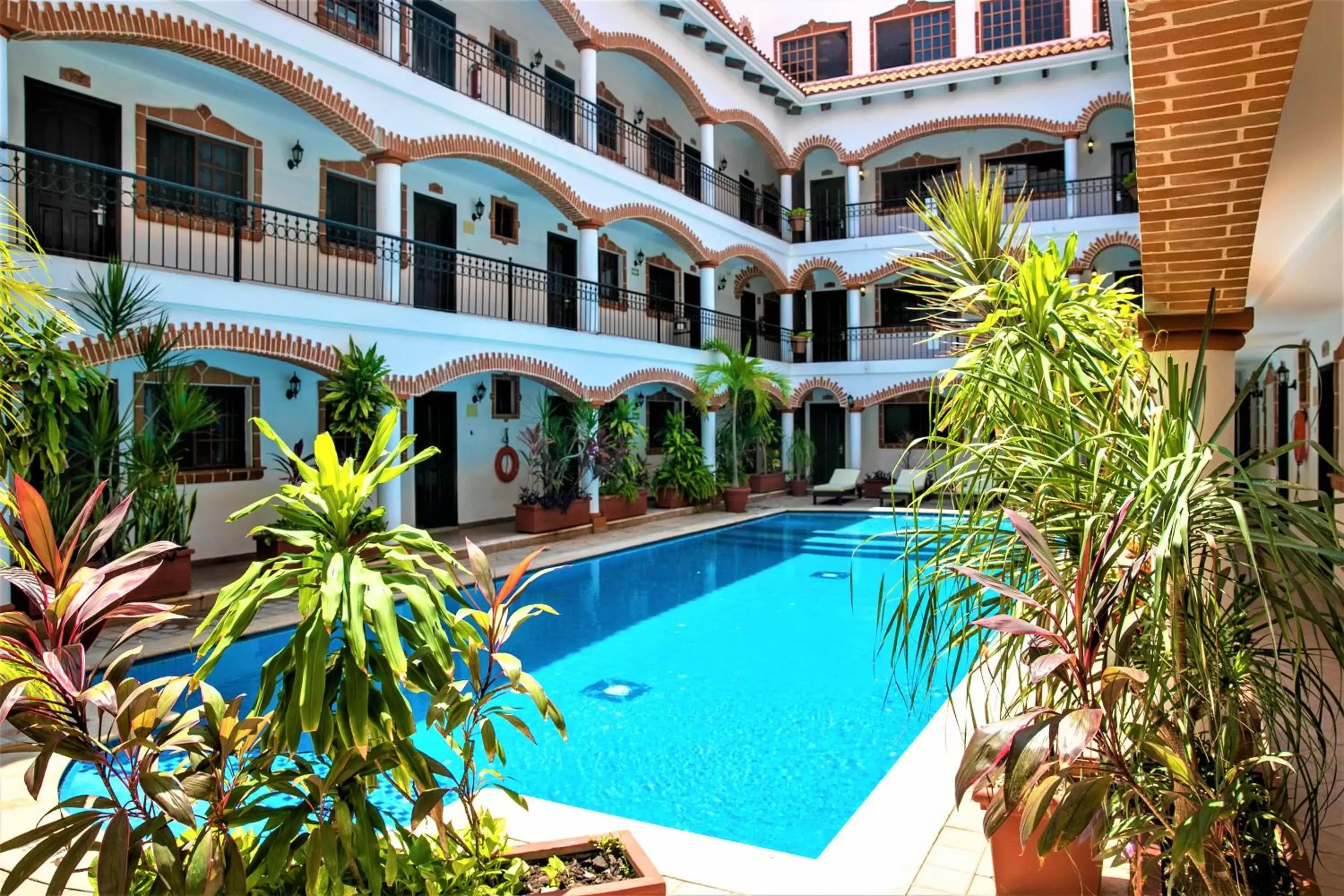 Garden, Swimming Pool in Hotel Colonial Playa del Carmen