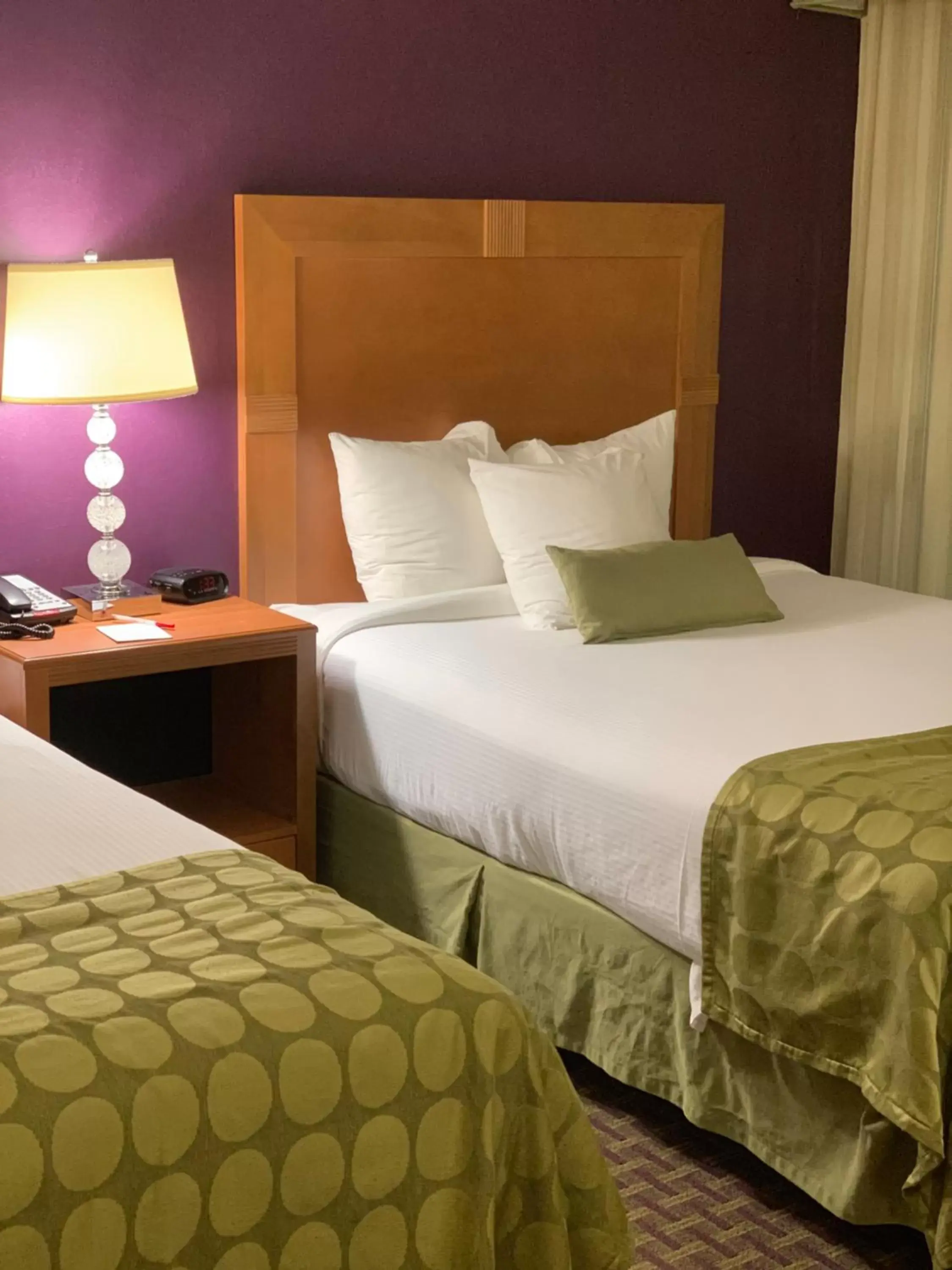 Bed in Ramada by Wyndham Marquette