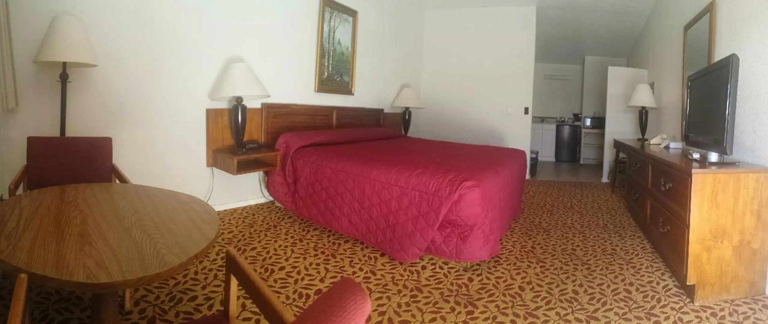 Bed in Western Inn Motel & RV Park