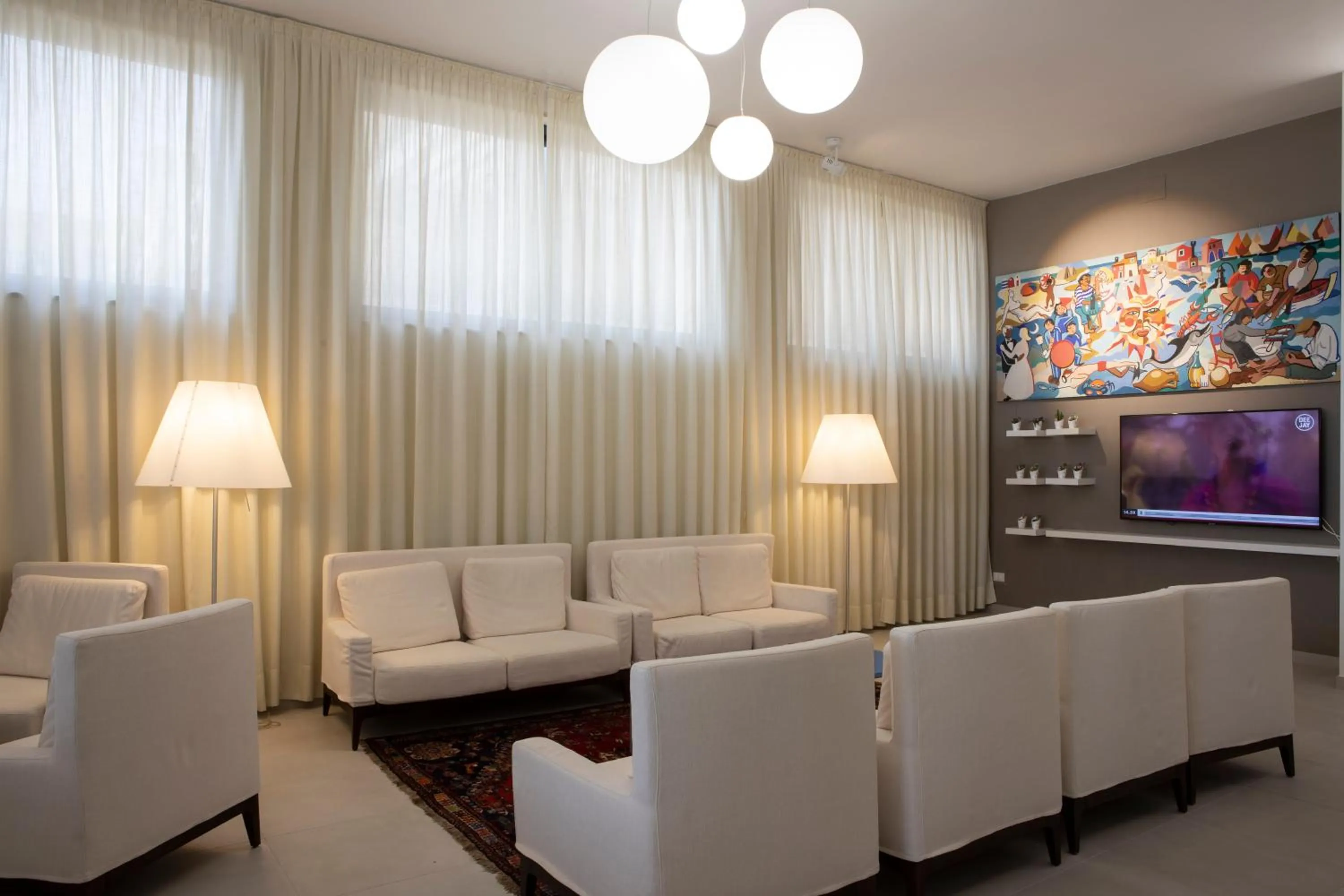 Communal lounge/ TV room in Hotel Marco Polo