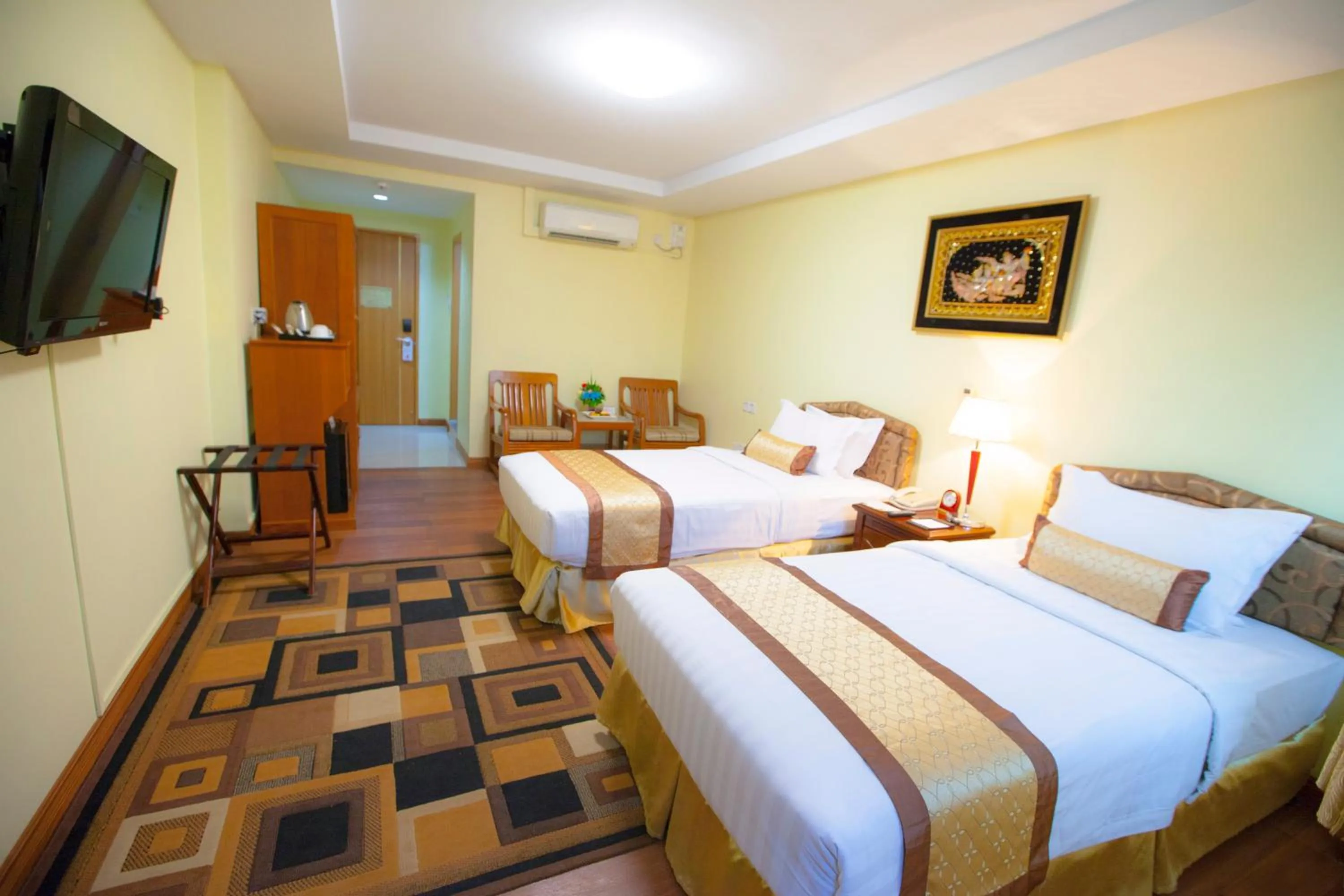 Bed in Grand Palace Hotel