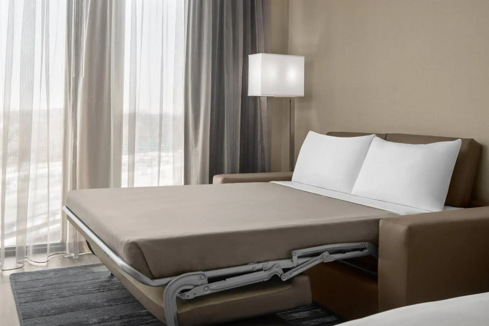 Bed in AC Hotel by Marriott Lansing University Area