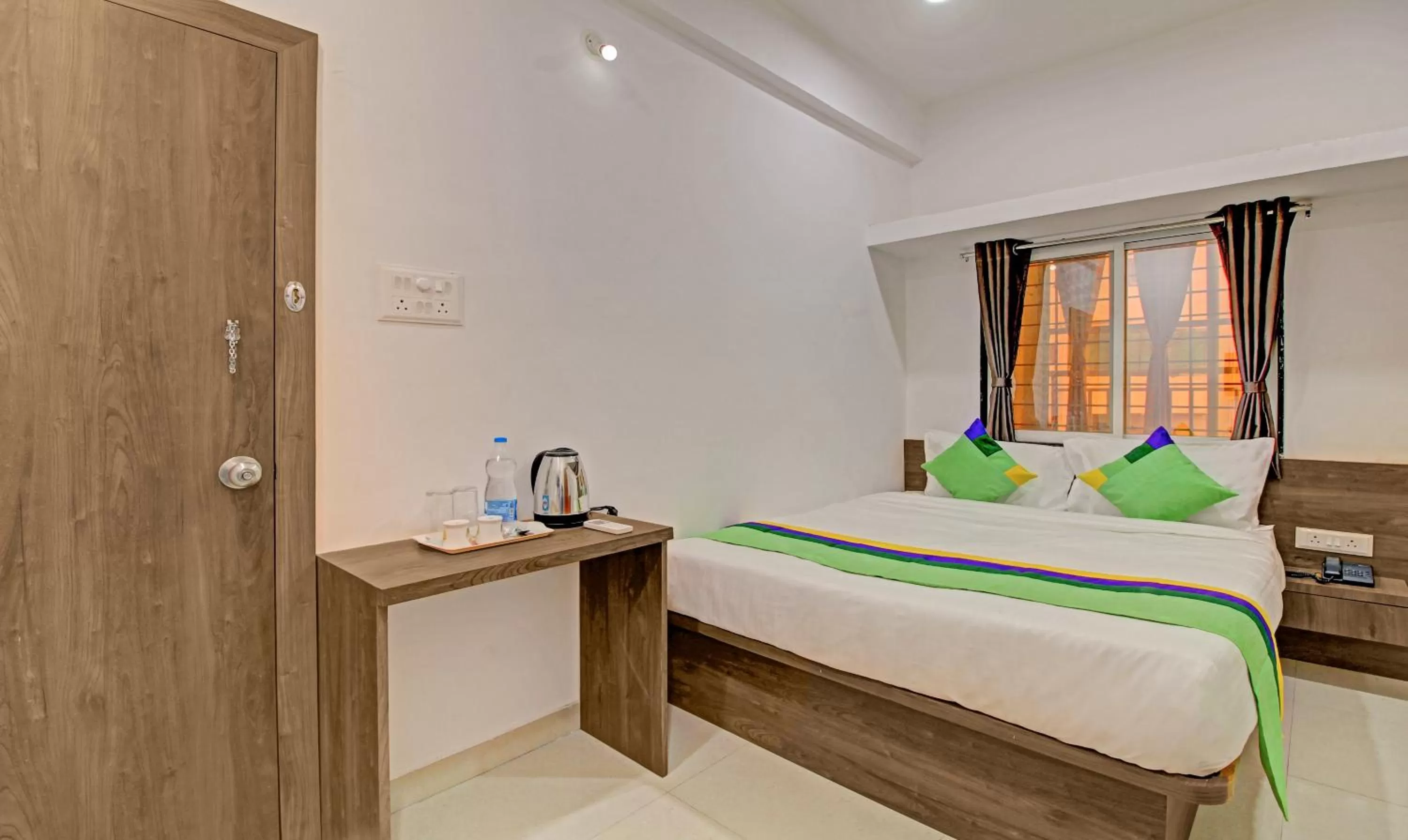 Bed in Treebo Trend White House