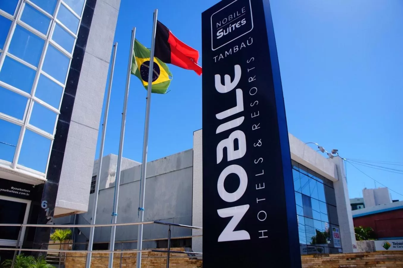 Property logo or sign in Nobile Suítes Tambaú