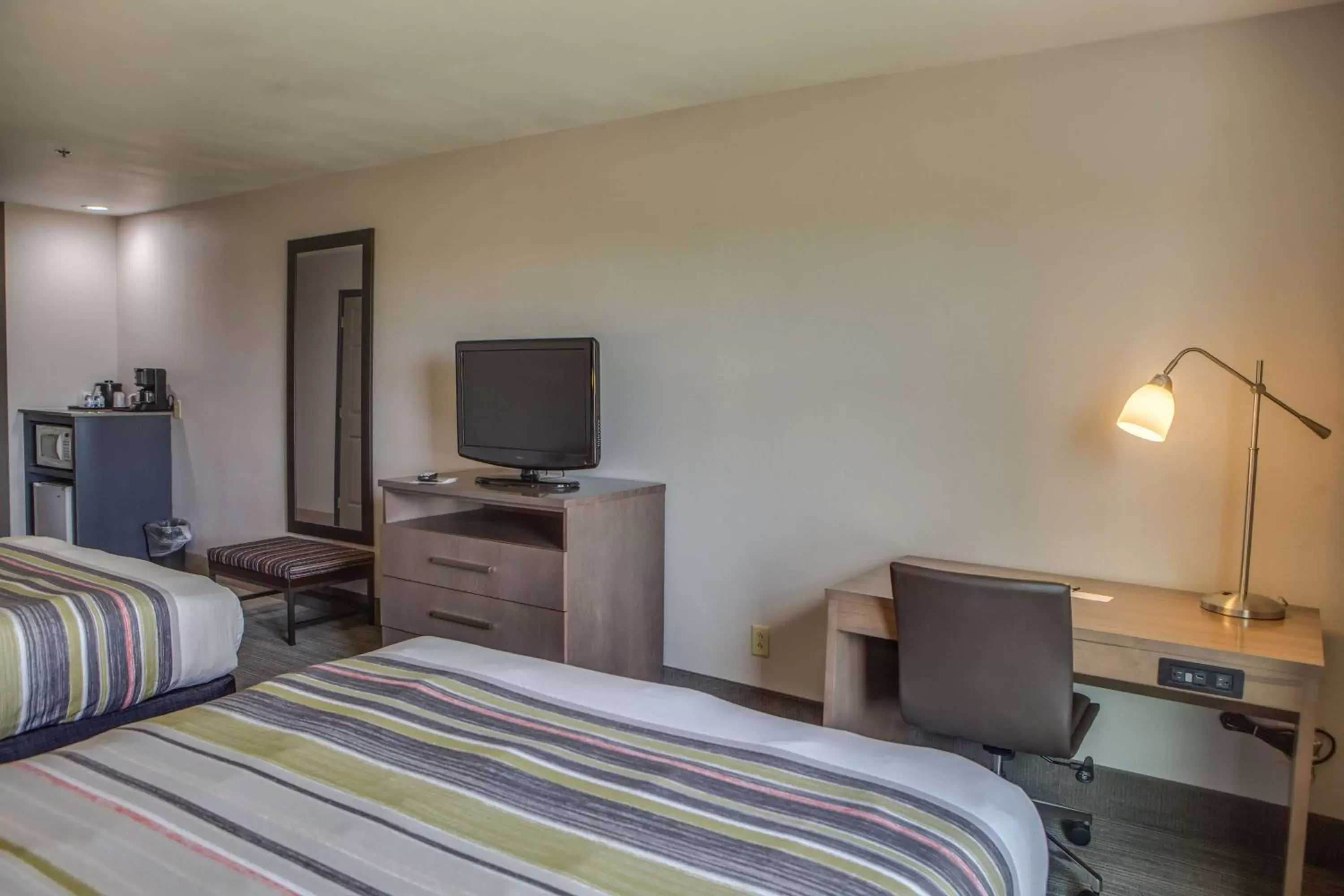 Photo of the whole room, TV/Entertainment Center in Country Inn & Suites by Radisson, Harlingen, TX