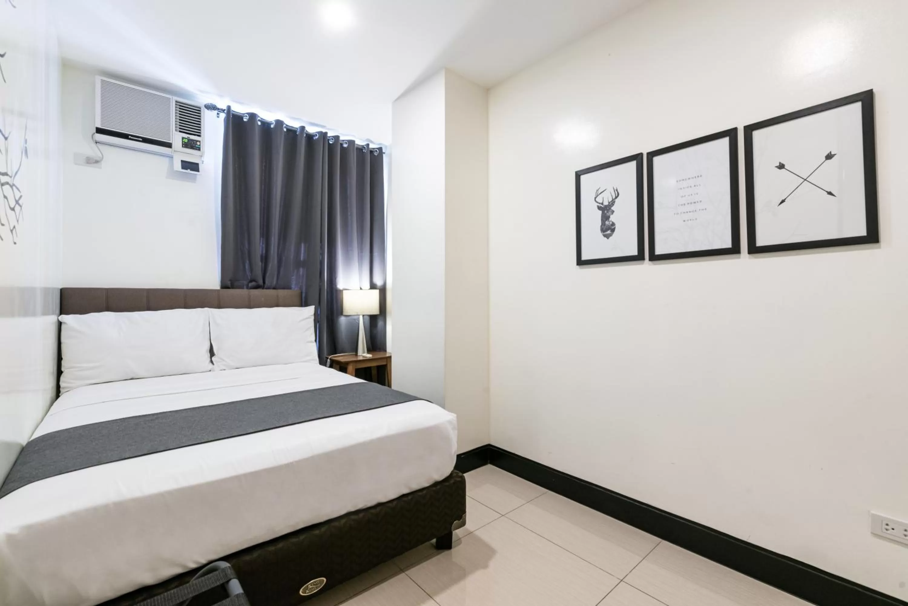 Bedroom, Bed in Artemis Place Makati Hotel