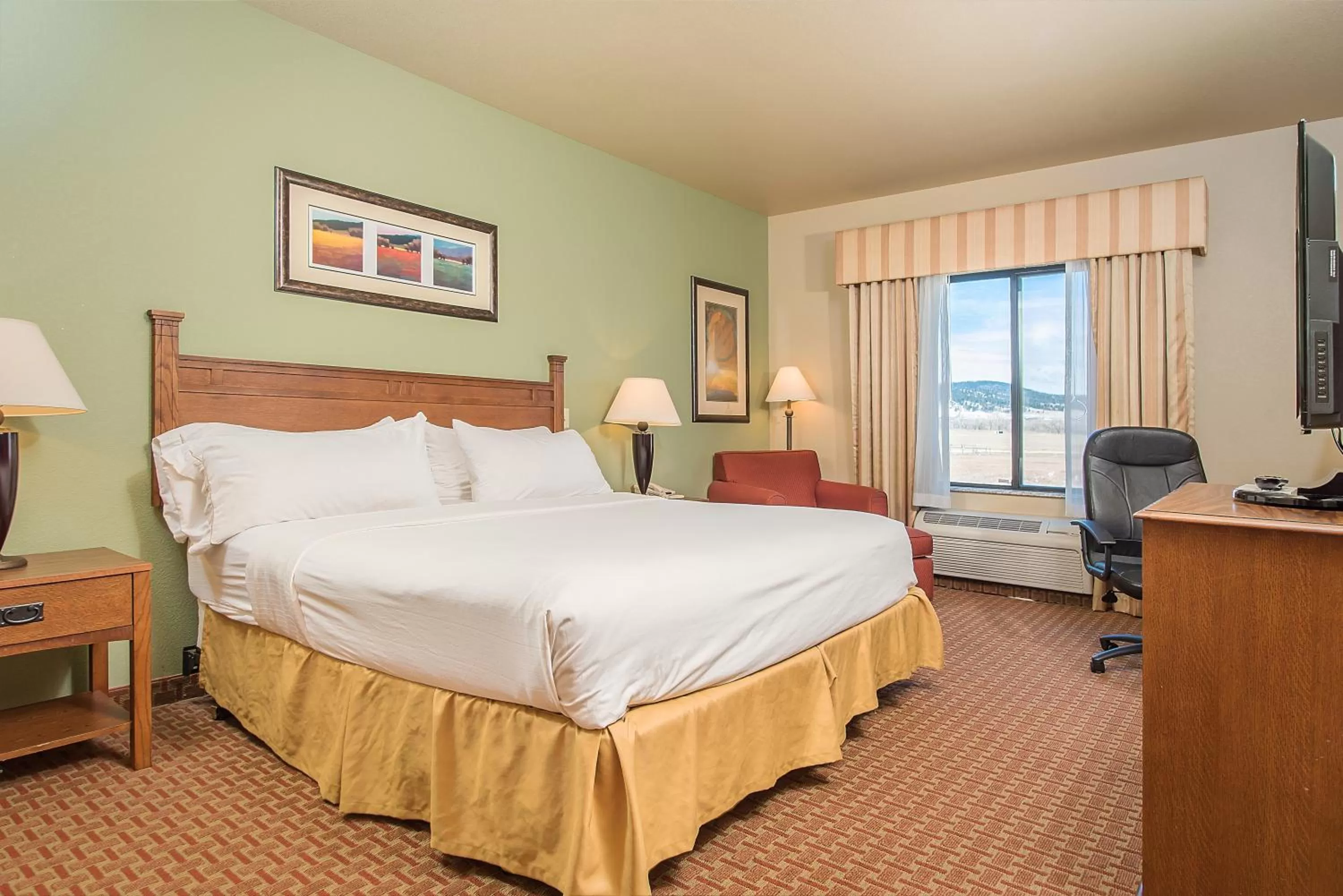 Bed in Baymont Inn & Suites by Wyndham Sturgis