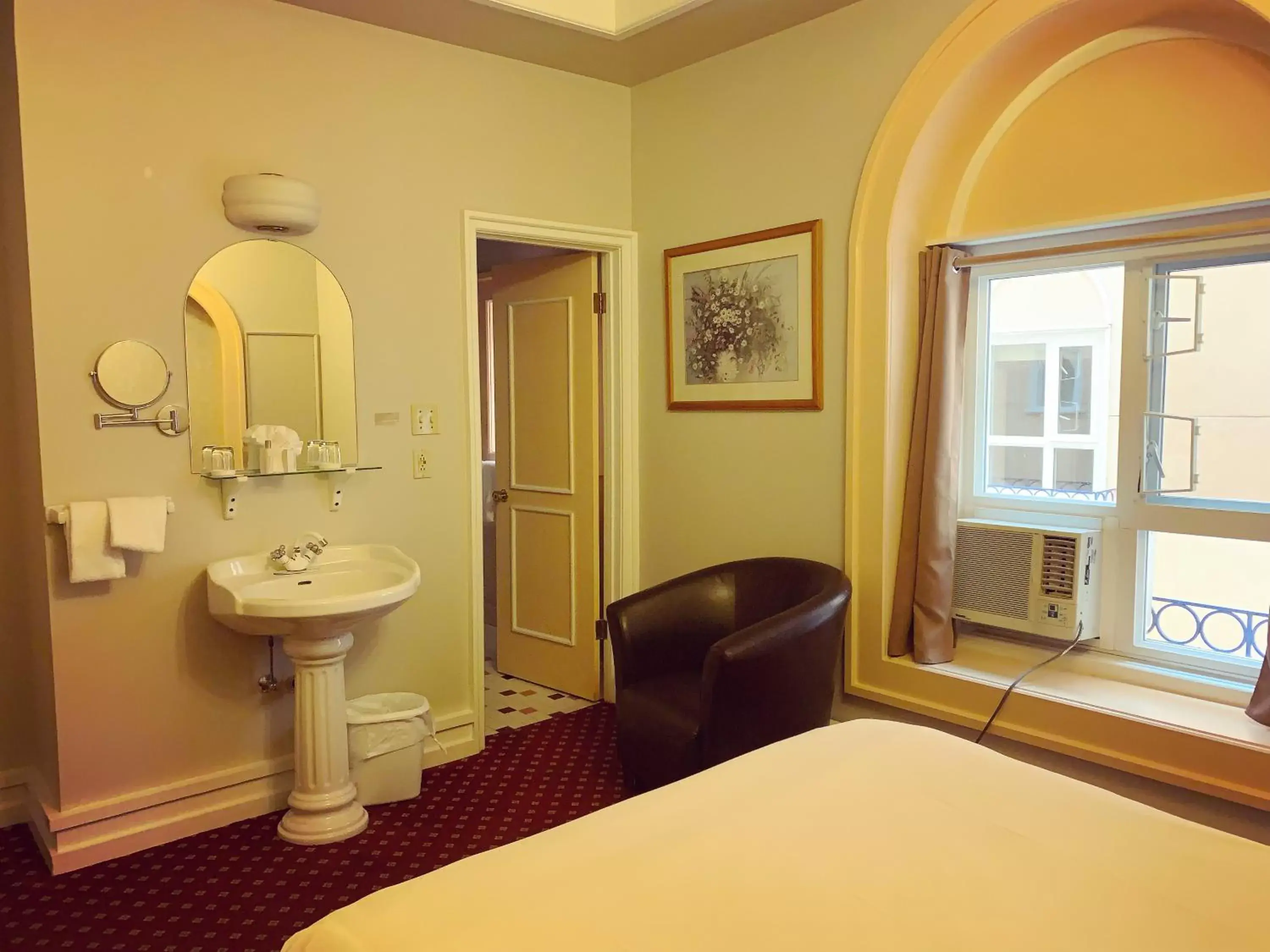 Bedroom in The Bedford Regency Hotel