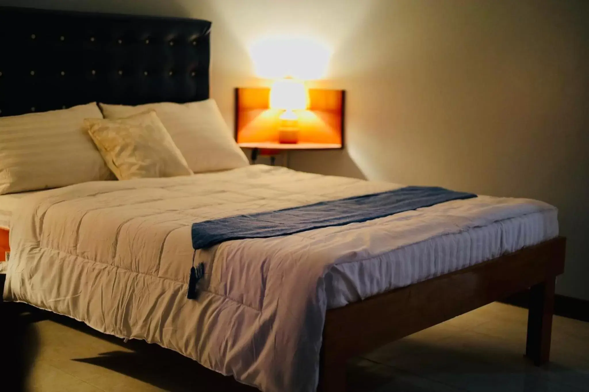 Bed in La Choeben Suites Bed in La Choeben Suites