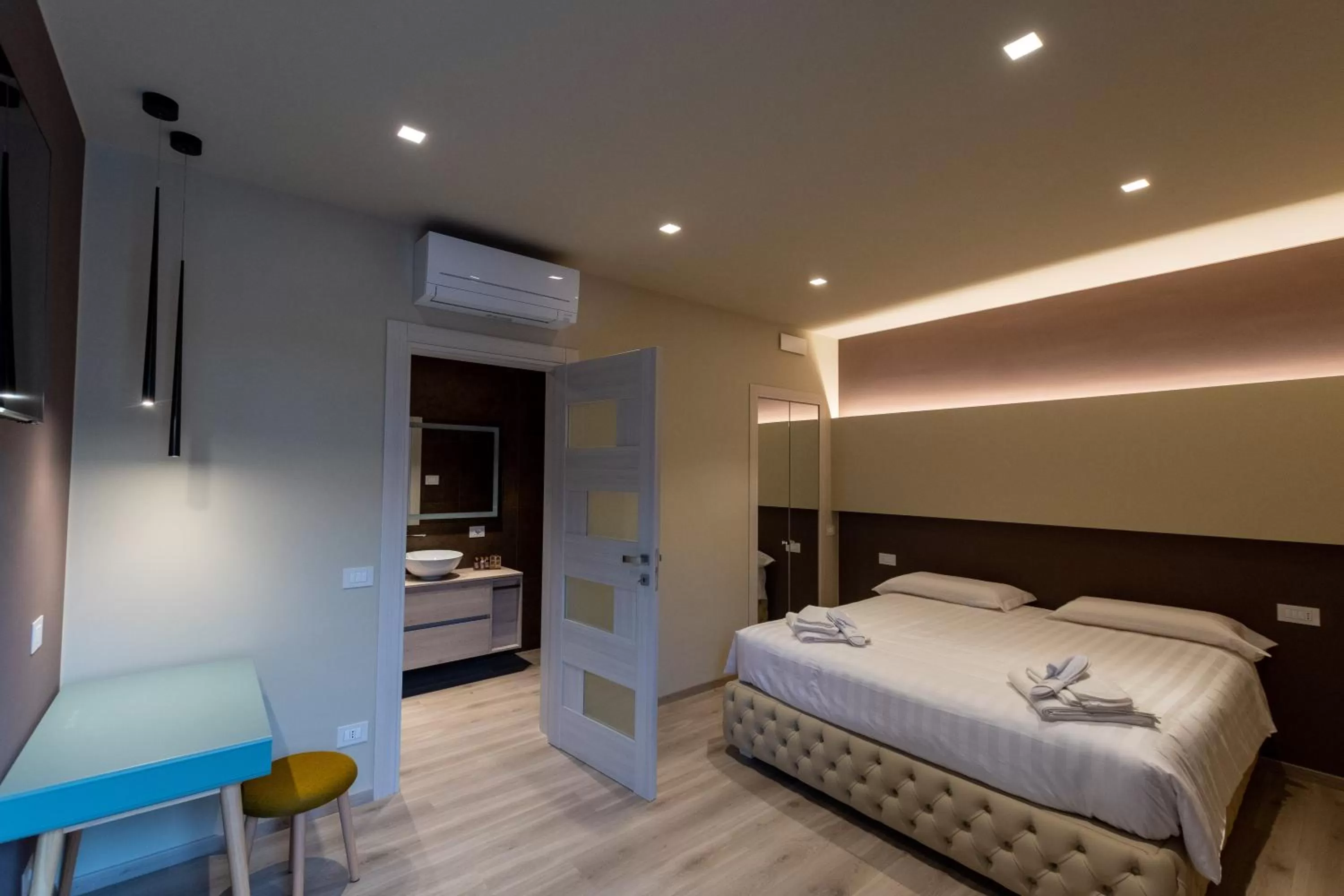 Bed in DiVino Rooms Deluxe